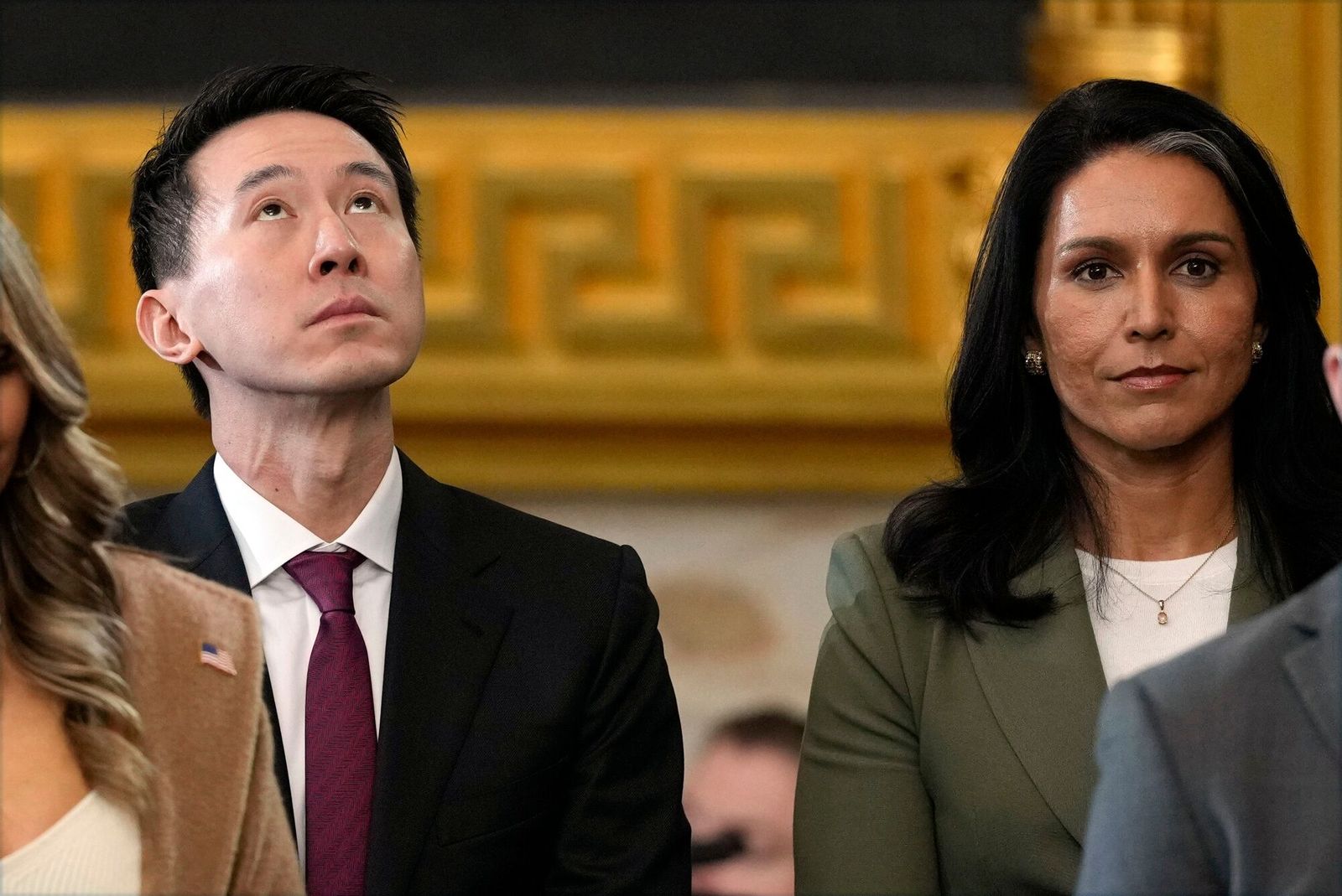 Shou Zi Chew, chief executive officer of TikTok Inc., left, and Tulsi Gabbard, former US Representative from Hawaii and US President-elect Donald Trump's nominee to be director of National Intelligence, during the 60th presidential inauguration in the rotunda of the US Capitol in Washington, DC, US, on Monday, Jan. 20, 2025. Donald Trump's Monday swearing-in marks just the second time in US history that a president lost the office and managed to return to power - a comeback cementing his place within the Republican Party as an enduring, transformational figure rather than a one-term aberration. Photographer: Julia Demaree Nikhinson/AP Photo/Bloomberg