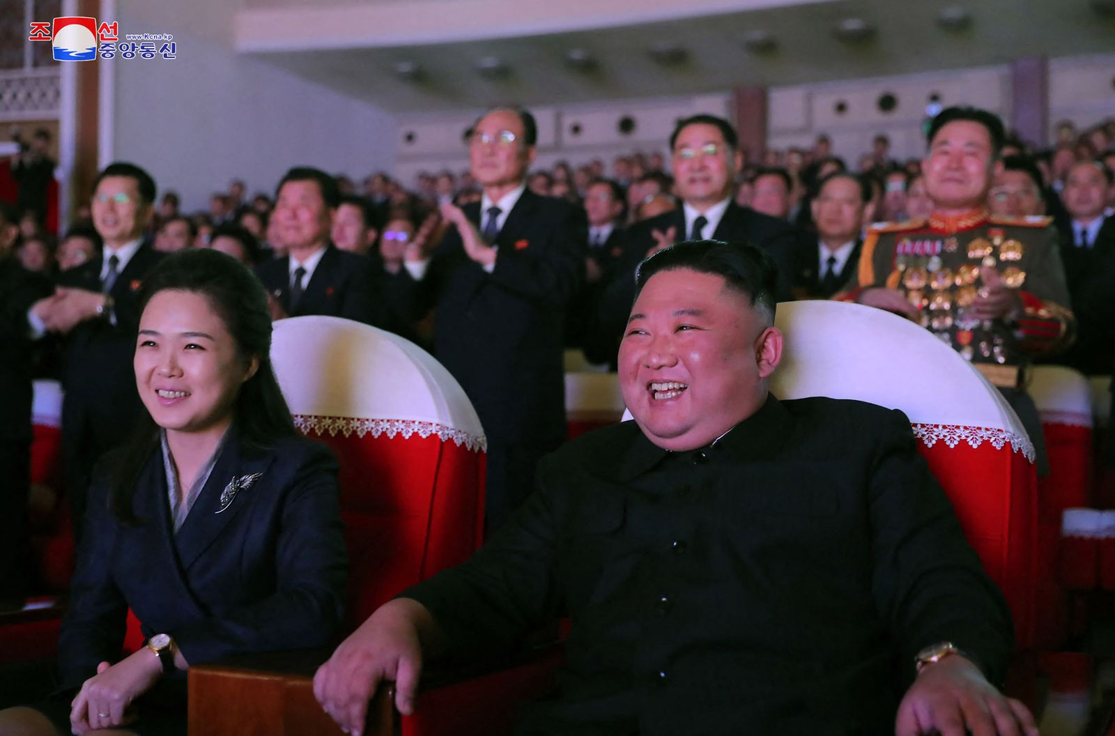 This picture taken on February 16, 2021 released from North Korea's official Korean Central News Agency (KCNA) on February 17 shows North Korean leader Kim Jong Un (R) and his wife Ri Sol Ju (L) watching a performance for celebrating the birth anniversary of Chairman Kim Jong Il at the Mansudae Art Theatre in Pyongyang. (Photo by STR / various sources / AFP) / - South Korea OUT / REPUBLIC OF KOREA OUT   ---EDITORS NOTE--- RESTRICTED TO EDITORIAL USE - MANDATORY CREDIT 