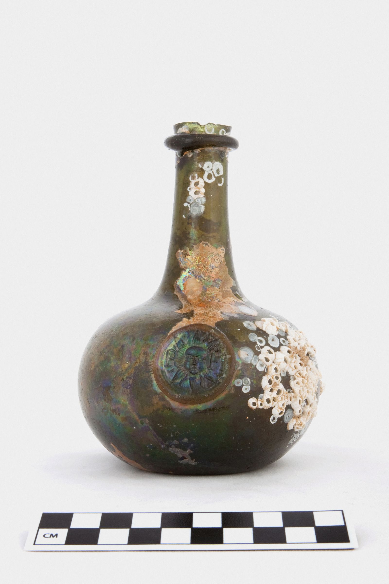 A quarter-size shaft and globe bottle with glass stamp recovered from the shipwreck of The Gloucester is pictured after the royal warship was discovered off the coast of Norfolk - via REUTERS