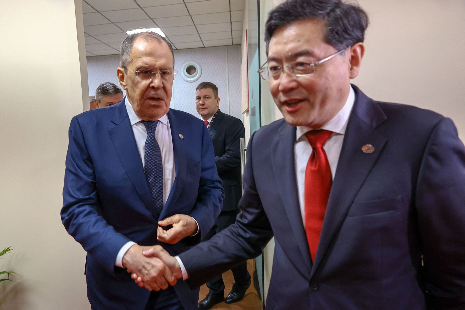 Russian Foreign Minister Sergei Lavrov (L) meets with China's Foreign Minister Qin Gang on the sidelines of the G20 foreign ministers' meeting in New Delhi on March 2, 2023. (Photo by Handout / RUSSIAN FOREIGN MINISTRY / AFP) / RESTRICTED TO EDITORIAL USE - MANDATORY CREDIT 