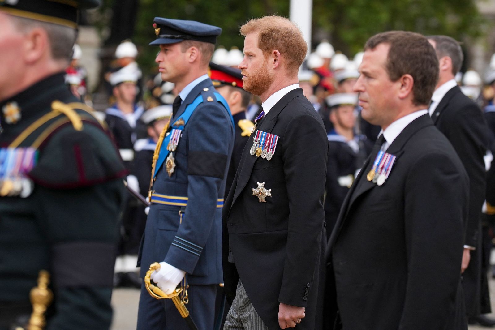 Prince Harry and Prince William follow a gun carriage carrying the coffin of Queen Elizabeth II during her funeral service in Westminster Abbey in central London Monday Sept. 19, 2022. - The Queen, who died aged 96 on Sept. 8, will be buried at Windsor alongside her late husband, Prince Philip, who died last year. (Photo by Emilio Morenatti / POOL / AFP) - AFP