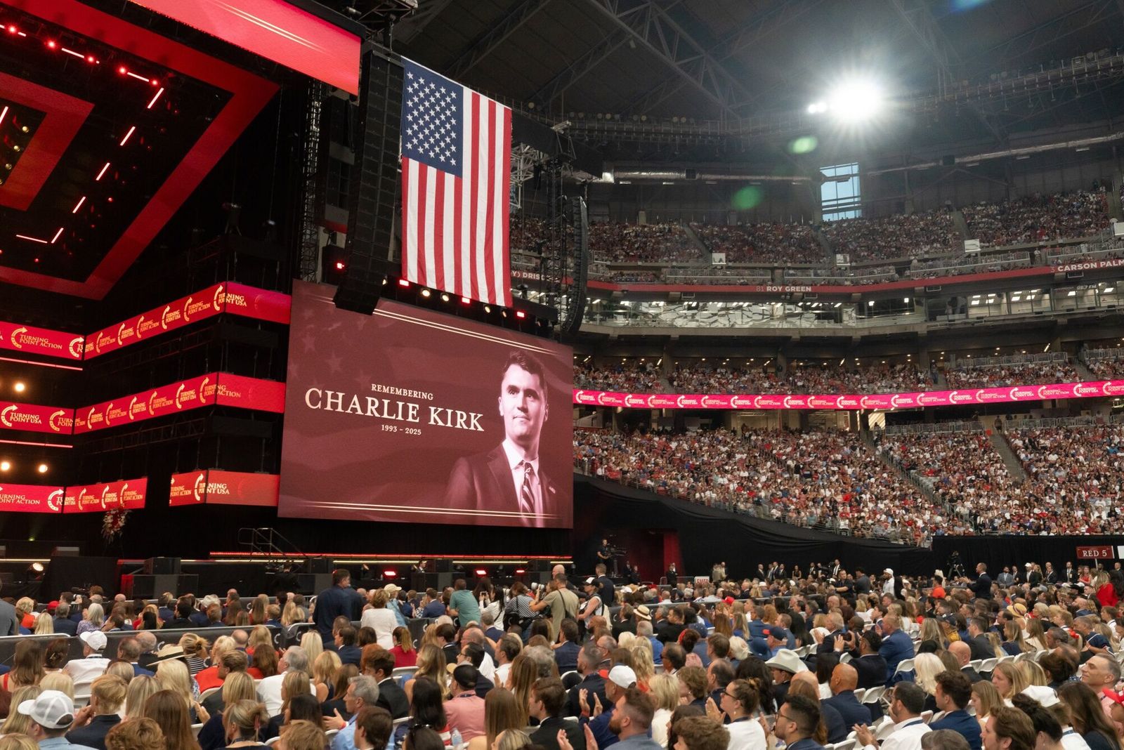 An image of Turning Point USA founder Charlie Kirk during a memorial service at State Farm Stadium in Glendale, Arizona, US, on Sunday, Sept. 21, 2025. President Donald Trump proclaimed Charlie Kirk a 'martyr for American freedom' in a memorial ceremony to commemorate the political activist as Erika Kirk said she forgave the man who gunned down her husband. Photographer: Rebecca Noble/Bloomberg