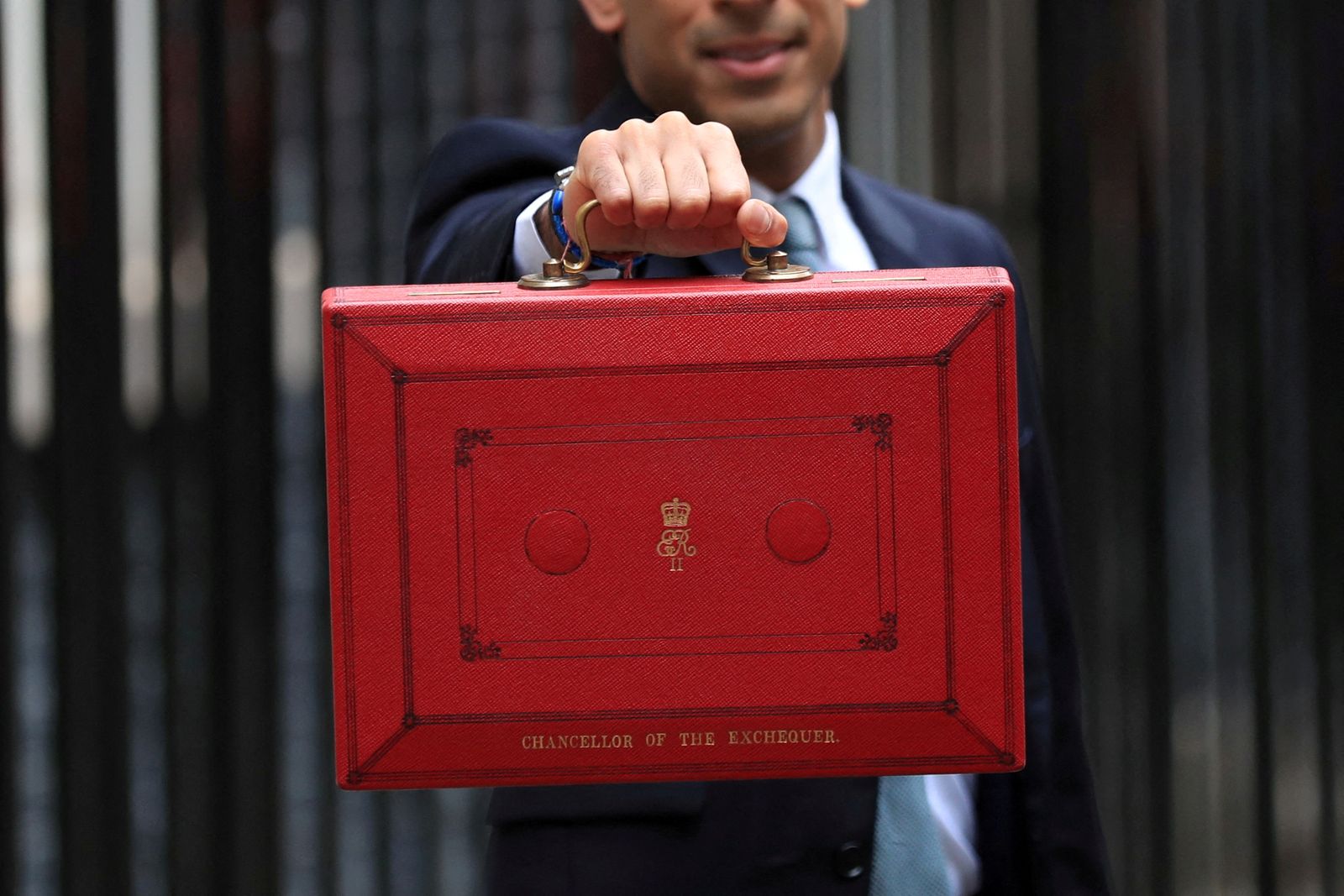 FILE PHOTO: Chancellor of the Exchequer Sunak holds the budget box outside Downing Street in London - REUTERS