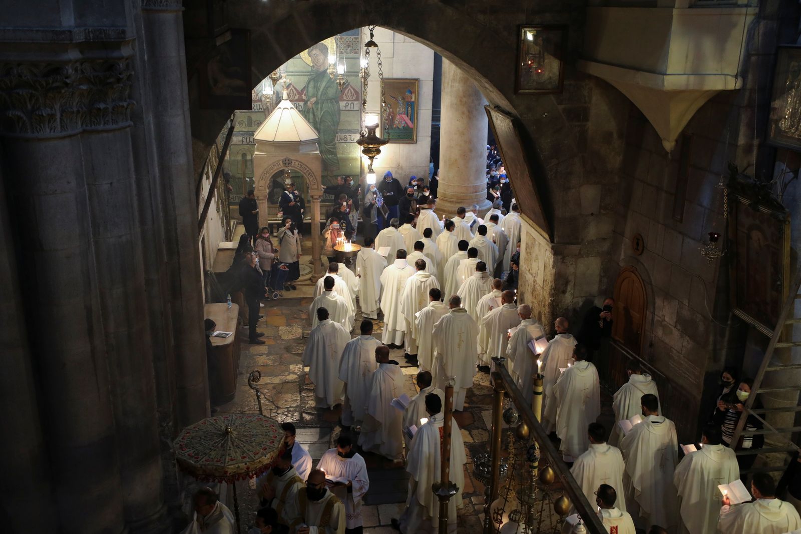 Worshippers take part in a procession during the Catholic Washing of the Feet ceremony on Easter Holy Week in the Church of the Holy Sepulchre in Jerusalem's Old City - REUTERS