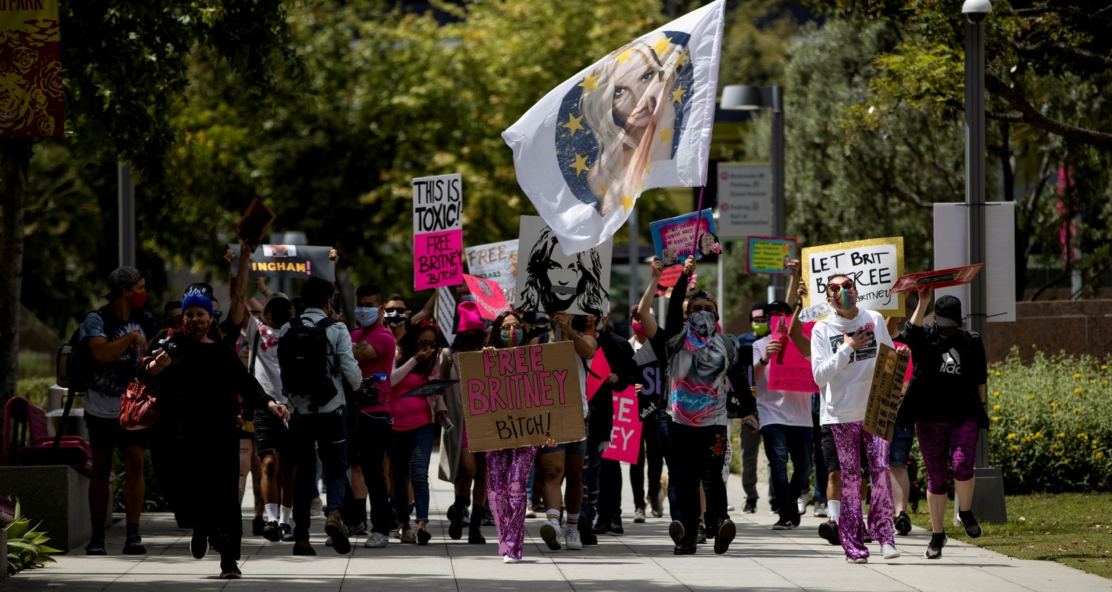 Supporters hold signs during a rally for pop star Britney Spears during a conservatorship case hearing at Stanley Mosk Courthouse in Los Angeles - REUTERS