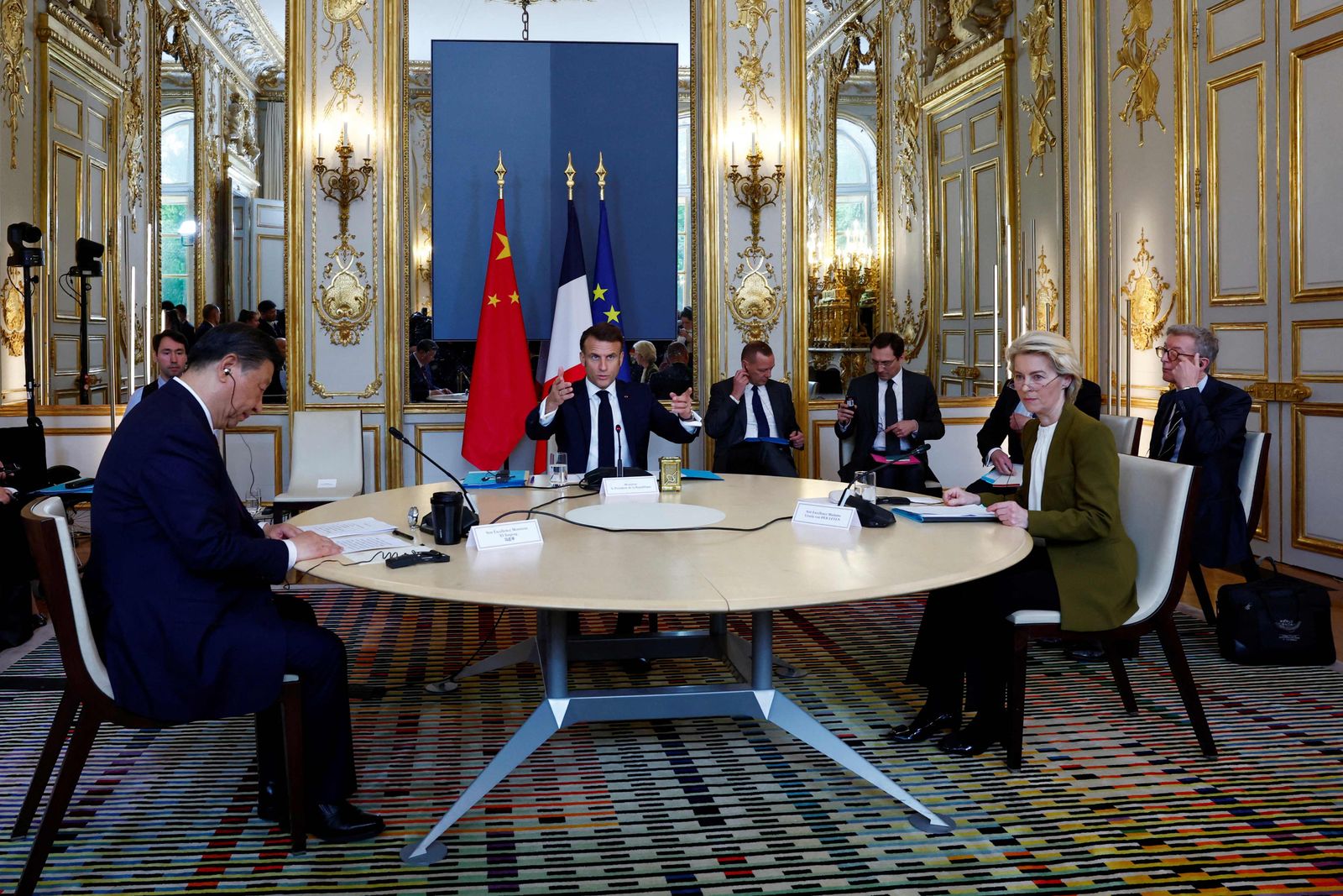 (From L) Chinese President Xi Jinping, France's President Emmanuel Macron, and European Commission President Ursula von der Leyen hold a trilateral meeting as part of the Chinese president's two-day state visit, at the Elysee Palace in Paris, on May 6, 2024. French President Emmanuel Macron is to host Xi Jinping for a state visit on May 6, 2024, seeking to persuade the Chinese leader to shift positions over Russia's invasion of Ukraine and also imbalances in global trade. Xi's first visit to Europe since 2019 will also see him hold talks in Serbia and Hungary. Xi has said he wants to find peace in Ukraine even if analysts do not expect major changes in Chinese policy. (Photo by Gonzalo Fuentes / POOL / AFP)