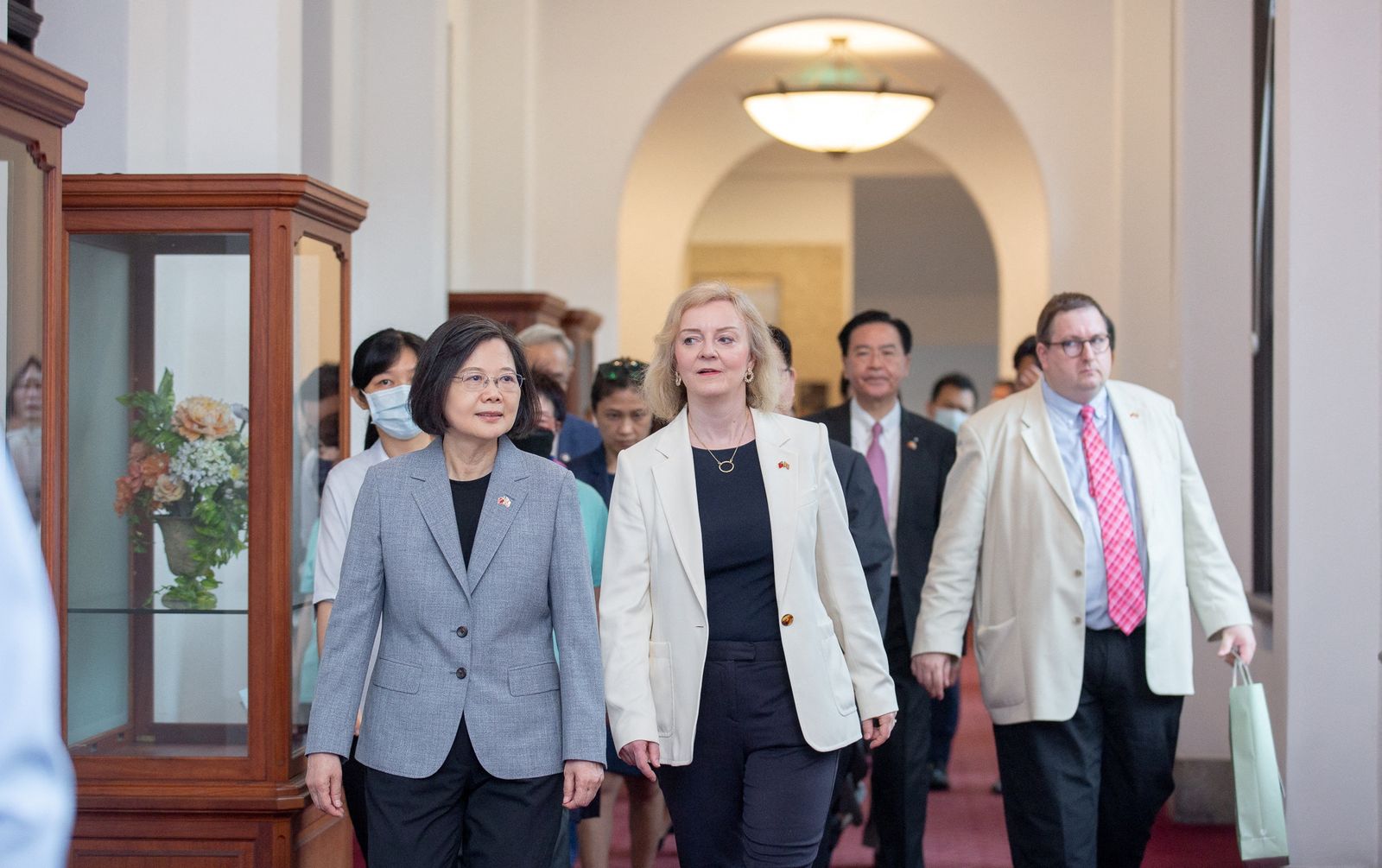 Taiwan President Tsai Ing-wen walks with former British Prime Minister Liz Truss in Taipei - VIA REUTERS