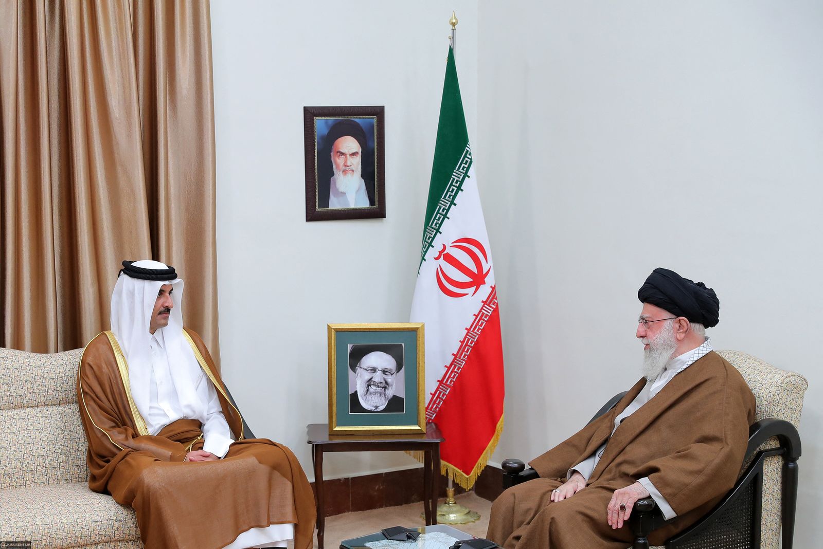A handout picture provided by the office of Iran's Supreme Leader Ayatollah Ali Khamenei on May 22, 2024, shows him receiving Qatar's Emir Sheikh Tamim bin Hamad al-Thani in Tehran, as leaders offer condolences for the death of the country's President Ibrahim Raisi and his entourage in a helicopter crash. Raisi was confirmed dead along with his foreign minister Hossein Amir-Abdollahian and six others on May 20, 2024, after search and rescue teams found their crashed helicopter in a fog-shrouded mountain region in Iran's East Azerbaijan province, sparking mourning in the Islamic republic. (Photo by KHAMENEI.IR / AFP) / RESTRICTED TO EDITORIAL USE - MANDATORY CREDIT 'AFP PHOTO / HO / KHAMENEI.IR' - NO MARKETING NO ADVERTISING CAMPAIGNS - DISTRIBUTED AS A SERVICE TO CLIENTS
