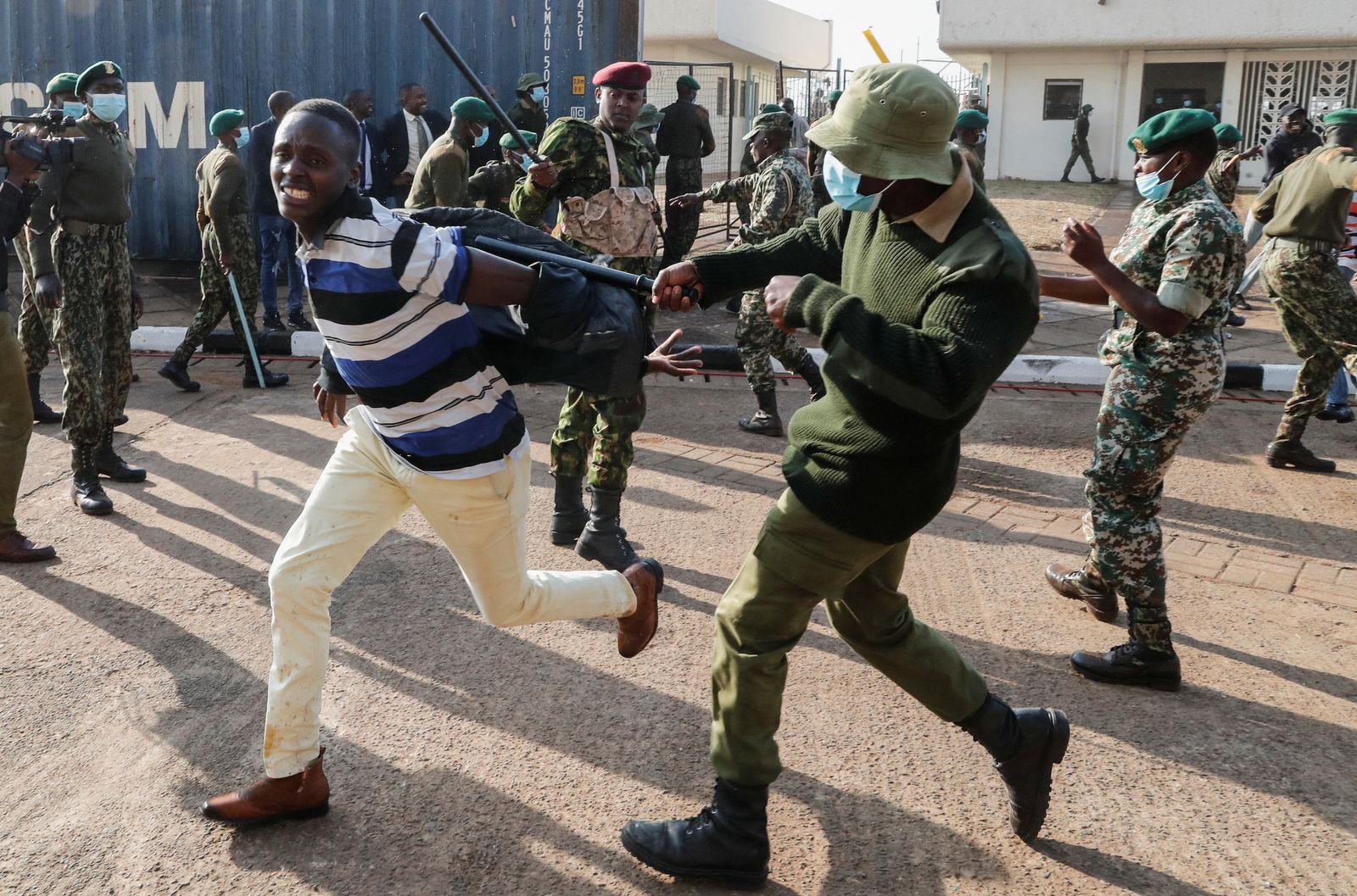 Riot police attempt to control people as they jostle to attend the inauguration of Kenya's President William Ruto before his swearing-in ceremony at the Kasarani Stadium in Nairobi - REUTERS