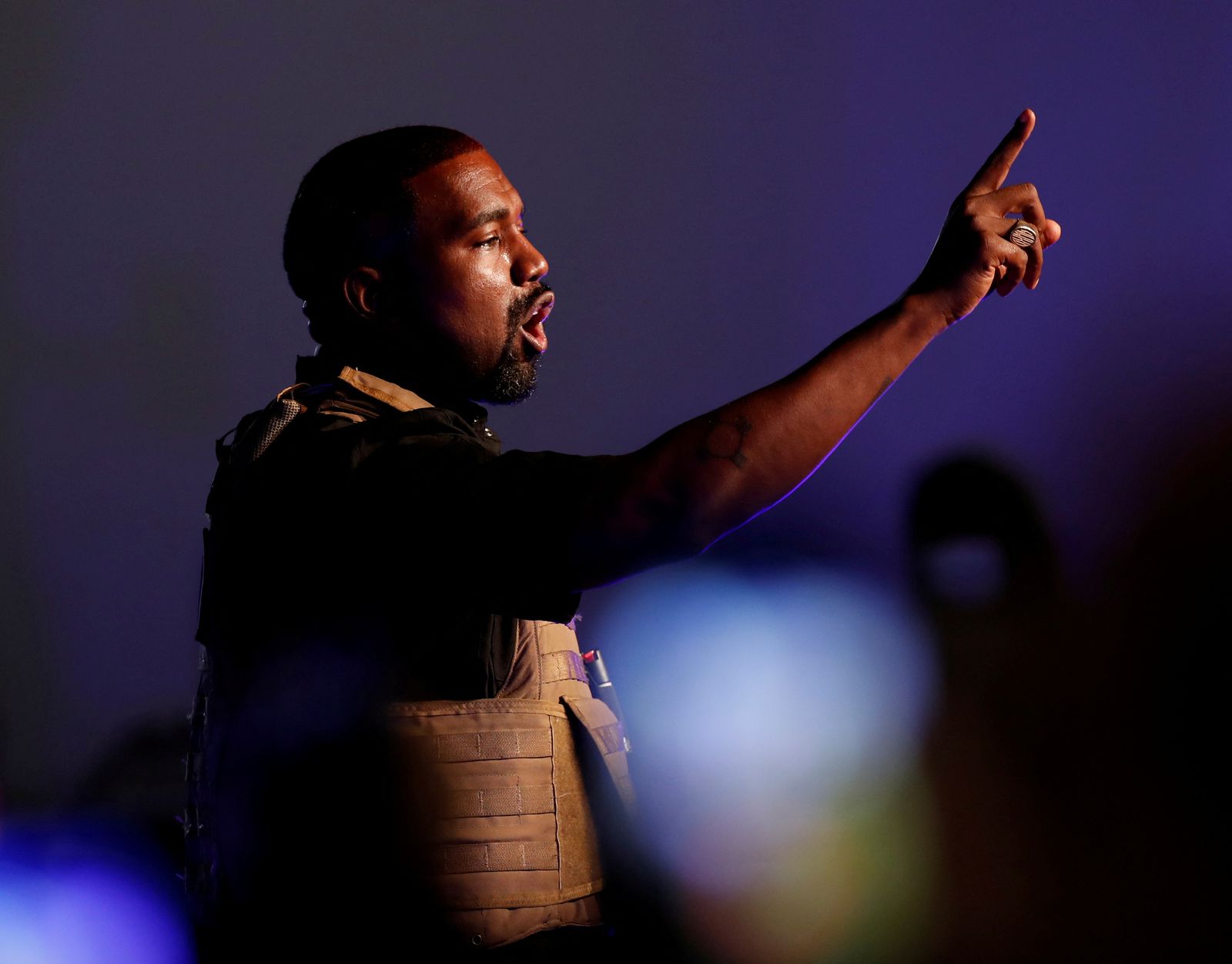 FILE PHOTO: Rapper Kanye West gestures to the crowd as he holds his first rally in support of his presidential bid in North Charleston - REUTERS