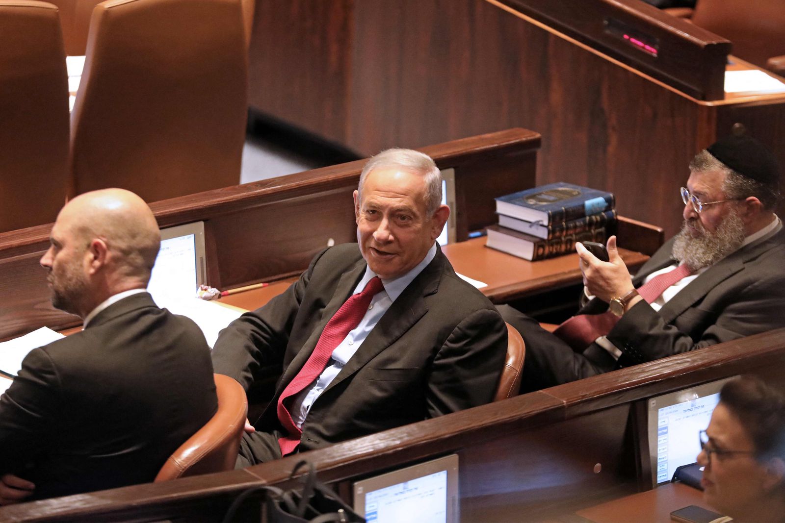 Israeli former premier Benjamin Netanyahu attends a preliminary vote on a bill to dissolve parliament and call an early election, at the Knesset in Jerusalem on June 22, 2022. - The government has said it wants to fast-track the bill but the opposition led by ex-premier Benjamin Netanyahu will attempt to block its passage in a bid to form a replacement government without the need for what would be Israel's fifth election in less than four years. (Photo by GIL COHEN-MAGEN / AFP) - AFP