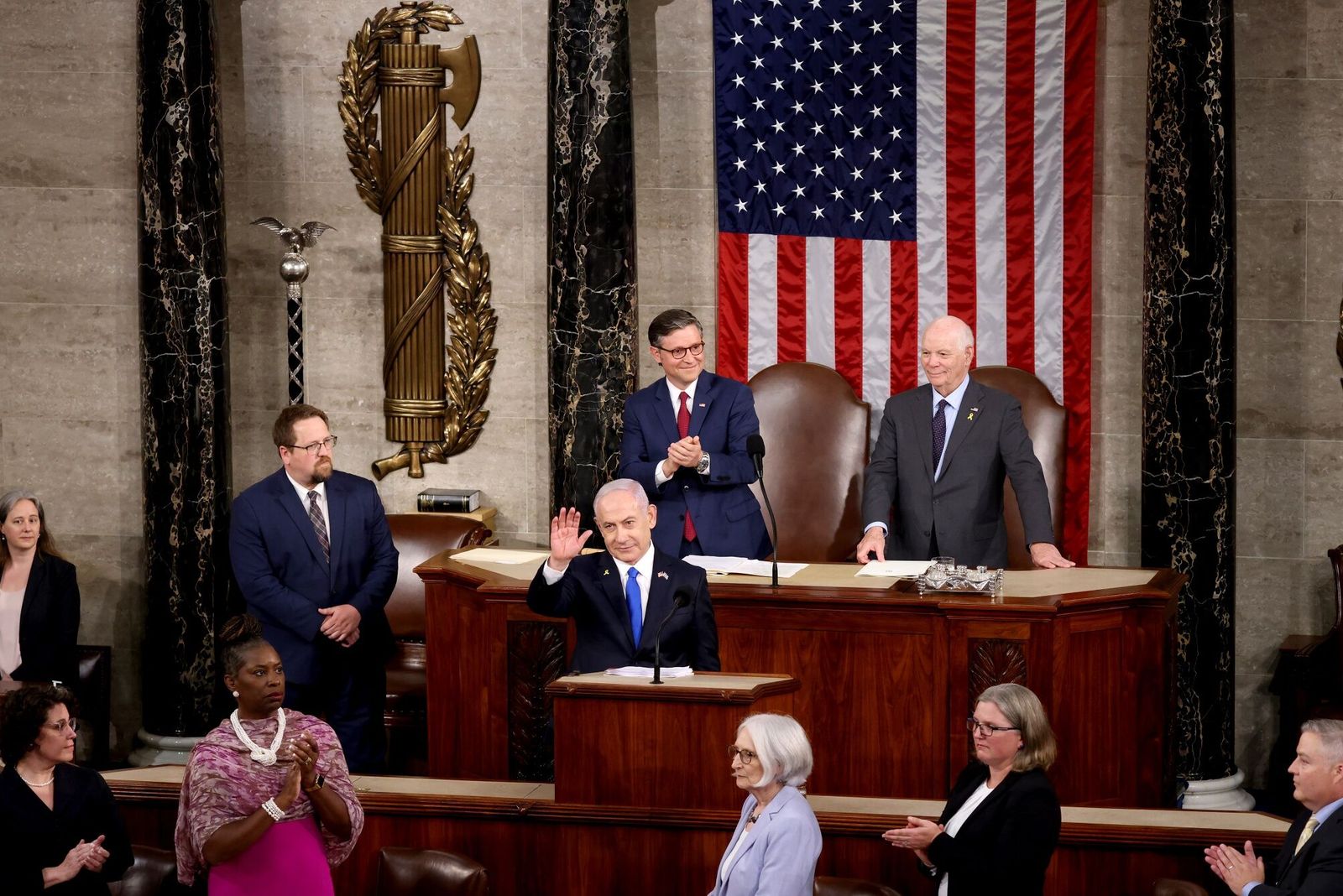 US House Speaker Mike Johnson, a Republican from Louisiana, from center left, Benjamin Netanyahu, Israel's prime minister, and Senator Ben Cardin, a Democrat from Maryland, during a joint meeting of Congress at the US Capitol in Washington, DC, US, on Wednesday, July 24, 2024. Netanyahu's speech to Congress will test whether Democrats can sustain their newfound unity over Vice President Kamala Harris despite searing divisions over Middle East policy. Photographer: Samuel Corum/Bloomberg