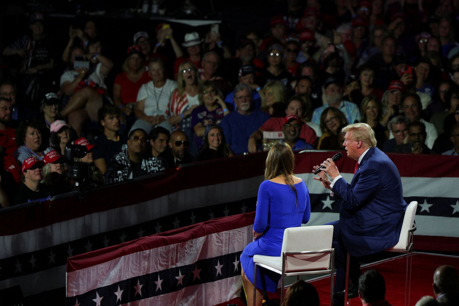 Republican presidential nominee and former U.S. President Donald Trump speaks during a campaign town hall meeting, moderated by Arkansas Governor Sarah Huckabee Sanders, in Flint, Michigan, U.S., September 17, 2024.  REUTERS/Brian Snyder