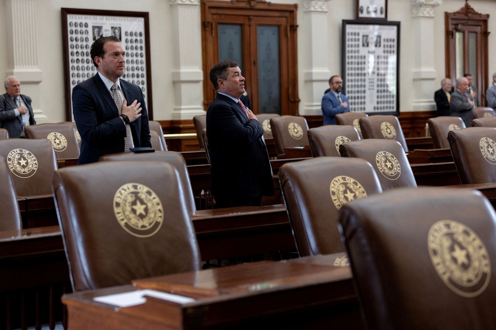 Surrounded by empty seats, Texas lawmakers say the pledge as the House is called to order, after Democratic lawmakers in Texas left the state to deny Republicans the quorum needed to redraw the state's 38 congressional districts, at the Texas State Capitol in Austin, Texas, U.S. August 4, 2025. The session was adjourned shortly due to the lack of quorum. REUTERS/Nuri Vallbona     TPX IMAGES OF THE DAY