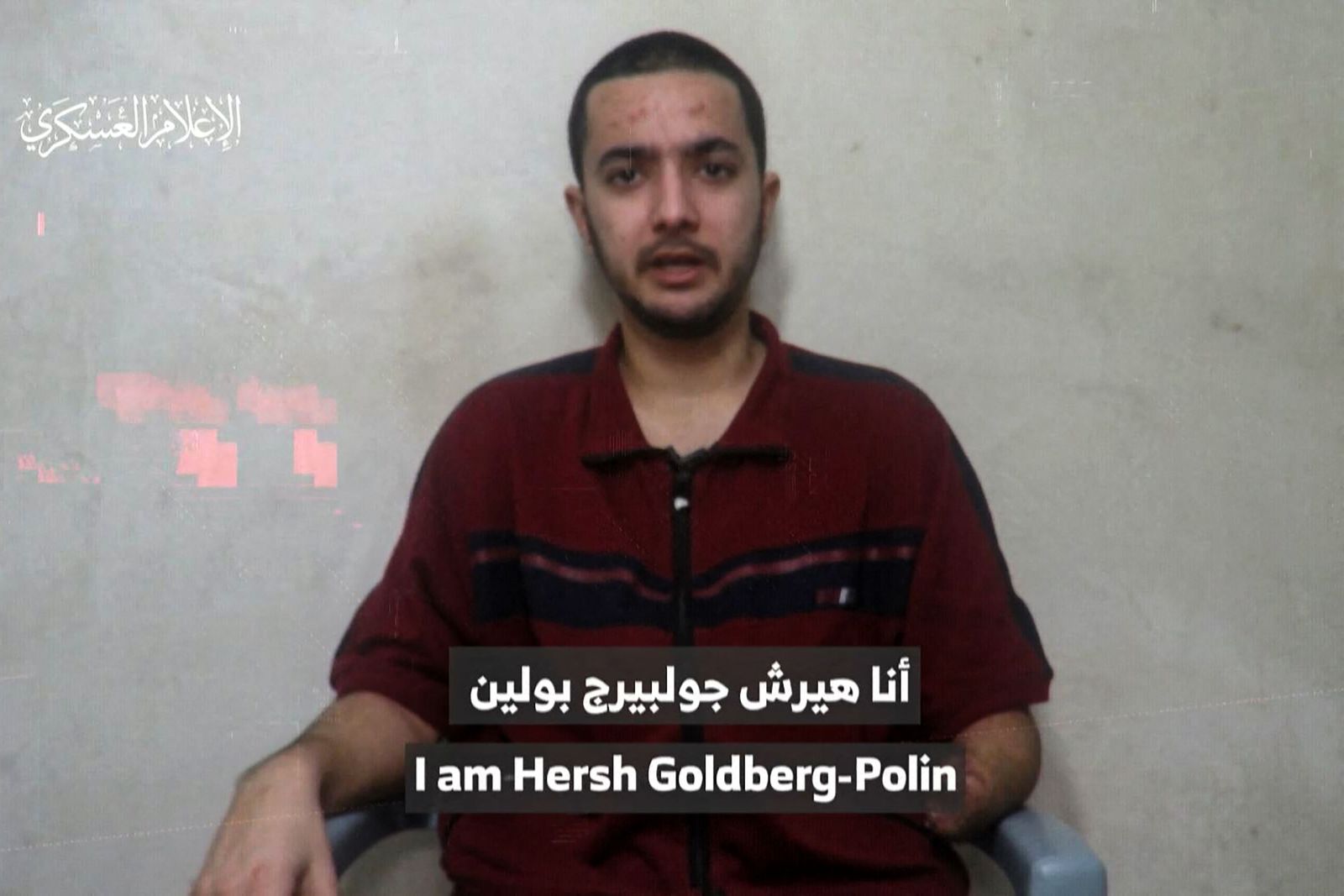 An image grab from a video released by the media office of the Palestinian militant group Hamas on April 24, 2024, shows an Israeli-American man who identified himself as Hersh Goldberg-Polin, 23, one of the hostages abducted from the Nova music festival in southern Israel during the Hamas attack on October 7, 2023, speaking to a camera. (Photo by Aline MANOUKIAN / various sources / AFP) / RESTRICTED TO EDITORIAL USE - MANDATORY CREDIT 'AFP PHOTO / HAMAS MEDIA OFFICE' - NO MARKETING NO ADVERTISING CAMPAIGNS - DISTRIBUTED AS A SERVICE TO CLIENTS --- NO ARCHIVE --- / ATTN CLIENTS: VIDEO FILMED UNDER DURESS. HERSH GOLDBERG-POLIN'S FAMILY HAS GIVEN PERMISSION FOR THE VIDEO TO BE USED BY THE MEDIA, THE HOSTAGES FAMILIES FORUM CAMPAIGN GROUP SAID IN A STATEMENT / ON-SCREEN SUBTITLES, EFFECTS FROM SOURCE.