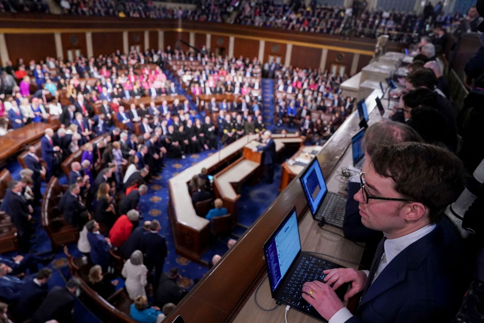 Members of the media working as US President Donald Trump speaks during a joint session of Congress in the House Chamber of the US Capitol in Washington, DC, US, on Tuesday, March 4, 2025. Donald Trump's primetime address Tuesday night from Capitol Hill, billed as a chronicle of his 'Renewal of the American Dream,' comes at a critical juncture early in his second term, as voters who elected him to tackle inflation and improve the economy are beginning to weigh the impact of his agenda. Photographer: Al Drago/Bloomberg