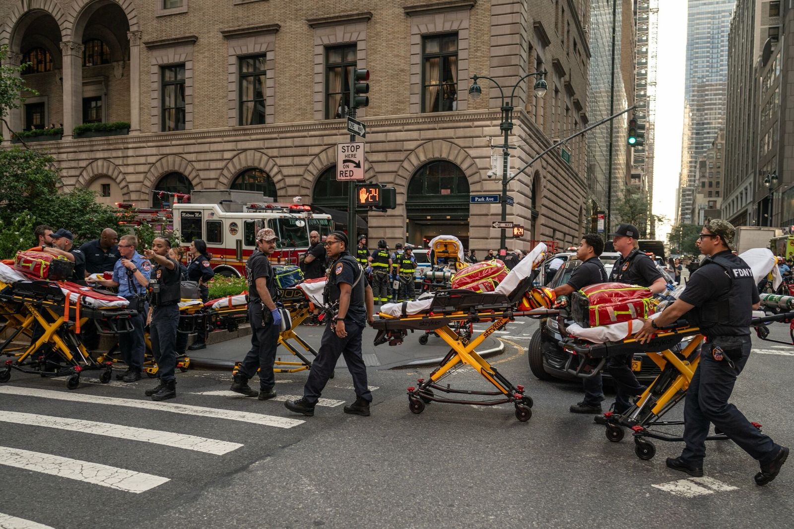 New York Fire Department (FDNY) paramedics respond to the scene of a shooting at 345 Park Ave. in New York, US, on Monday, July 28, 2025. An active shooter attacked 345 Park Ave. in Manhattan, the tower housing�Blackstone Inc.'s global headquarters and the National Football League among others, killing one police officer and injuring several other people, according to a city official. Photographer: Victor J. Blue/Bloomberg