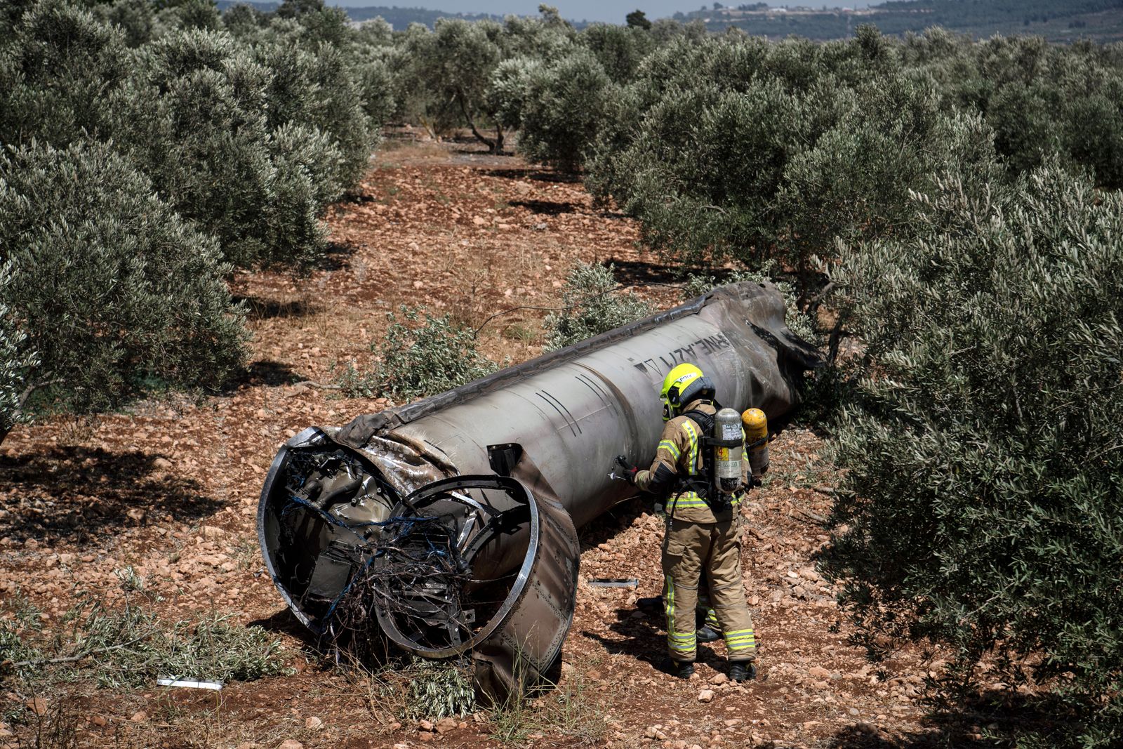 Israeli special force check the apparent remains of a ballistic missile before it will be evacuated from the location it was found lying in northern Israel, following missiles attacks by Iran on Israel, at northernn, Israel June 18, 2025. REUTERS/Gil Eliyahu  ISRAEL OUT. NO COMMERCIAL OR EDITORIAL SALES IN ISRAEL