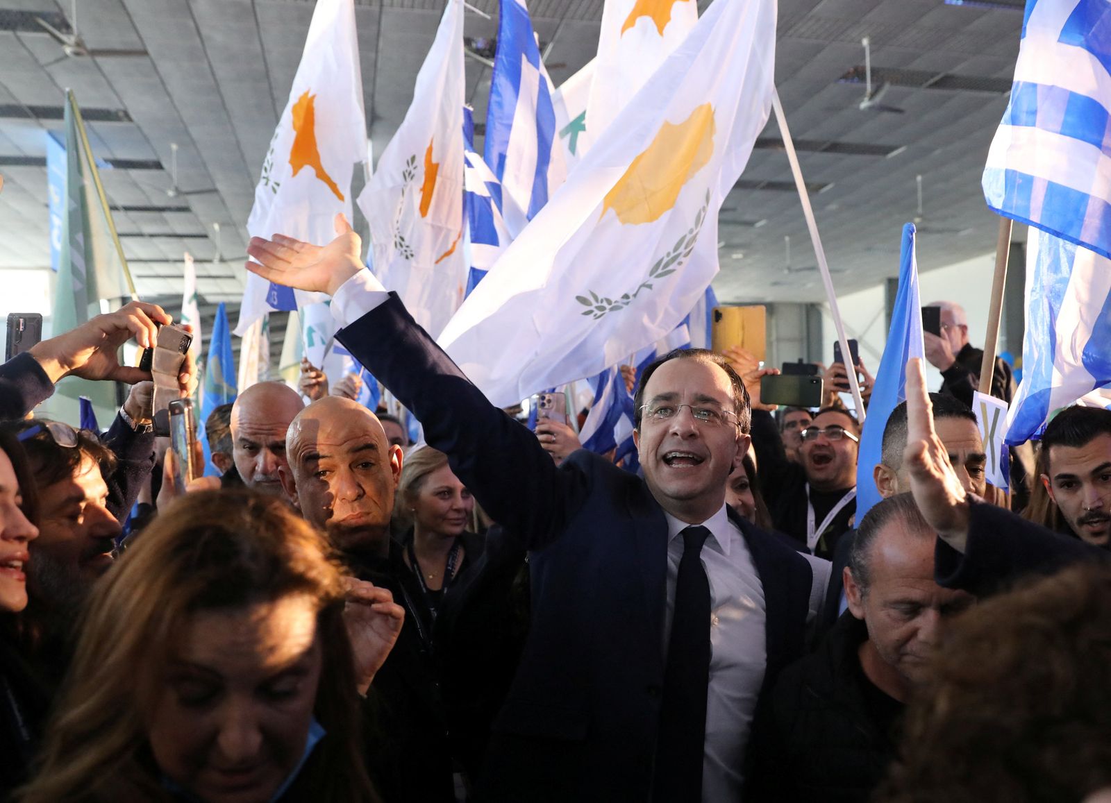 Cyprus presidential candidate Nikos Christodoulides waves to supporters during a pre-election rally in Nicosia - REUTERS