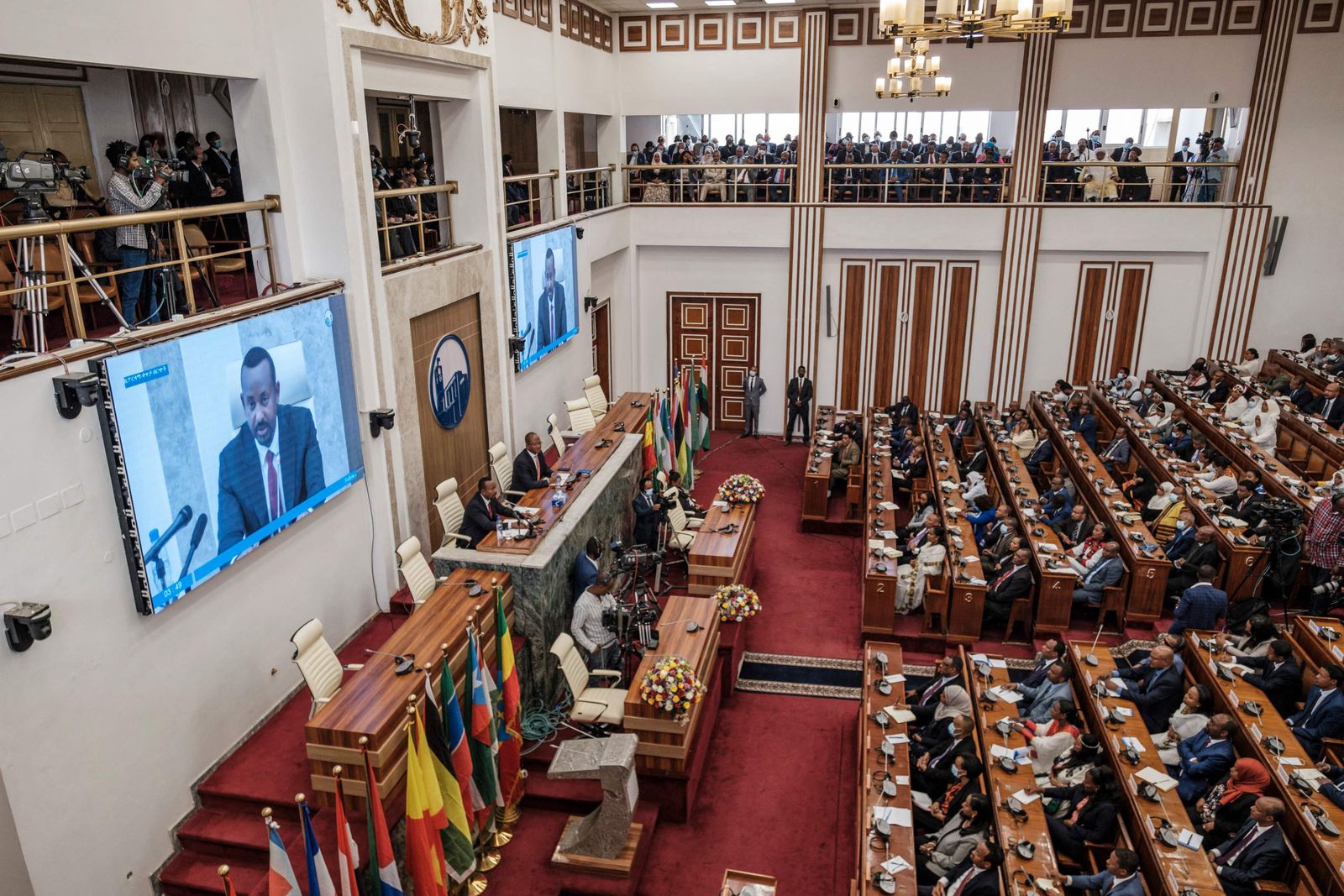 Ethiopian Primer Minister Abiy Ahmed (L) addresses the members of the Parliament during a session, in the city of Addis Ababa, Ethiopia, on June 14, 2022. (Photo by EDUARDO SOTERAS / AFP) - AFP
