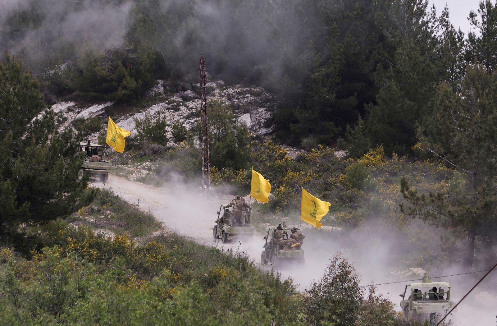 Hezbollah members take part in a military exercise during a media tour organized for the occasion of Resistance and Liberation Day, in Aaramta - REUTERS