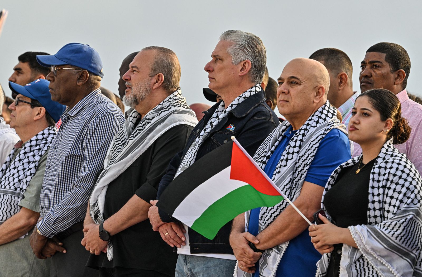 (L-R) Cuba's Foreign Minister Bruno Rodriguez, Cuba's Vice President Salvador Valdes Mesa, Cuba's Prime Minister Manuel Marrero, Cuba's President Miguel Diaz-Canel, Secretary of Organization of the Central Committee of the Communist Party of Cuba Roberto Morales, and a Palestinian woman take part in a demonstration in support of the Palestinian people outside the US Embassy in Havana, on March 2, 2024. (Photo by ADALBERTO ROQUE / AFP)