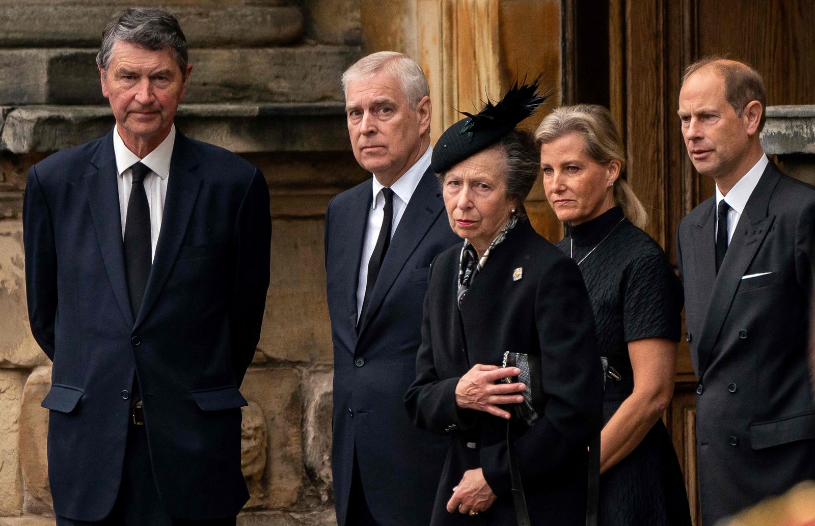 Vice Admiral Timothy Laurence (L) Britain's Prince Andrew, Duke of York (2L), Britain's Princess Anne, Princess Royal (C), Britain's Sophie, Countess of Wessex (2R) and Britain's Prince Edward, Earl of Wessex await the arrival of the hearse carrying the coffin of the late Queen Elizabeth II, at the Palace of Holyroodhouse, in Edinburgh on September 11, 2022. - Queen Elizabeth II's coffin will travel by road through Scottish towns and villages on Sunday as it begins its final journey from her beloved Scottish retreat of Balmoral. The Queen, who died on September 8, will be taken to the Palace of Holyroodhouse before lying at rest in St Giles' Cathedral, before travelling onwards to London for her funeral.. (Photo by Aaron Chown / POOL / AFP) - AFP
