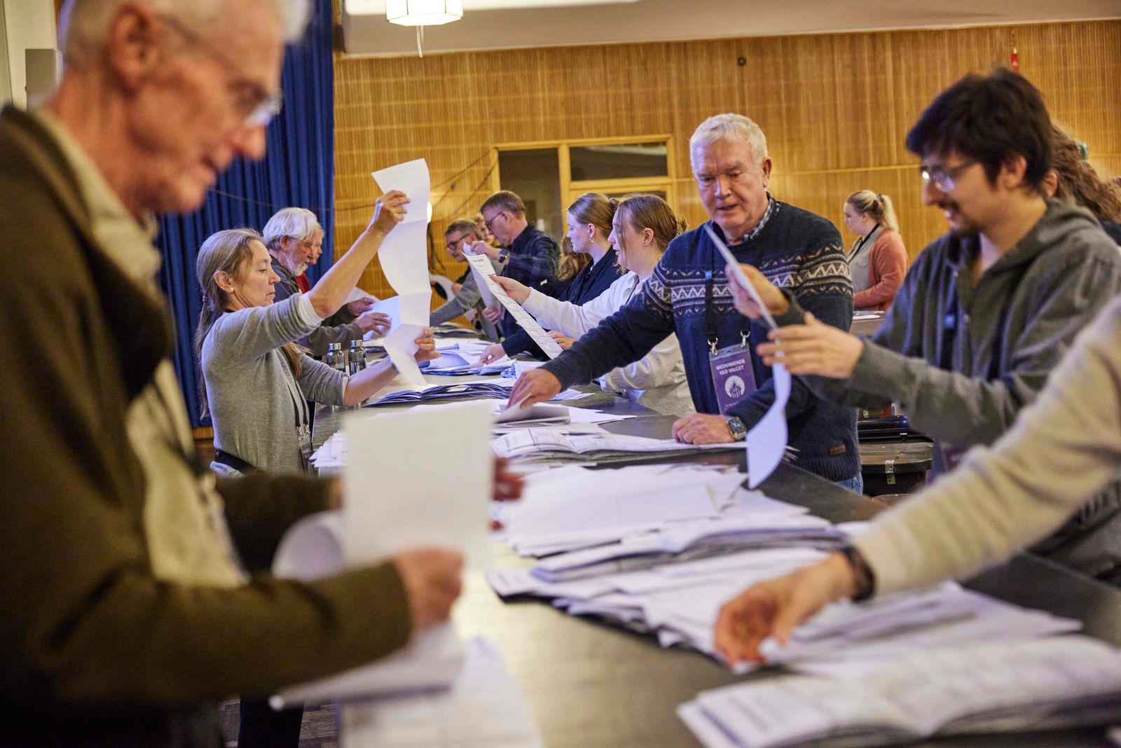 Members of the local electoral commission count votes at the polling station in the Aarhus Town Hall in Aarhus, Denmark, on November 1, 2022. - Denmark's left-wing bloc appeared to take the lead in Tuesday's general election but without a majority, exit polls showed, setting up the new centrist Moderate party as likely kingmaker. (Photo by Mikkel Berg Pedersen / Ritzau Scanpix / AFP) / Denmark OUT - AFP