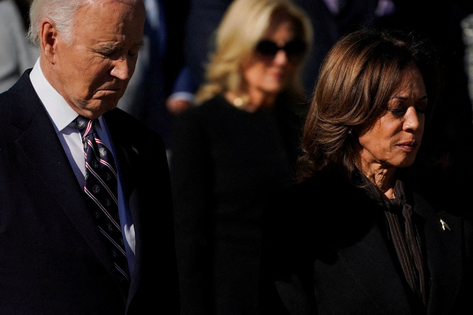 U.S. President Joe Biden, U.S. Vice President Kamala Harris and U.S. first lady Jill Biden take part in a wreath laying ceremony on Veterans Day at Arlington National Cemetery in Arlington, Virginia, U.S., November 11, 2024. REUTERS/Nathan Howard     TPX IMAGES OF THE DAY