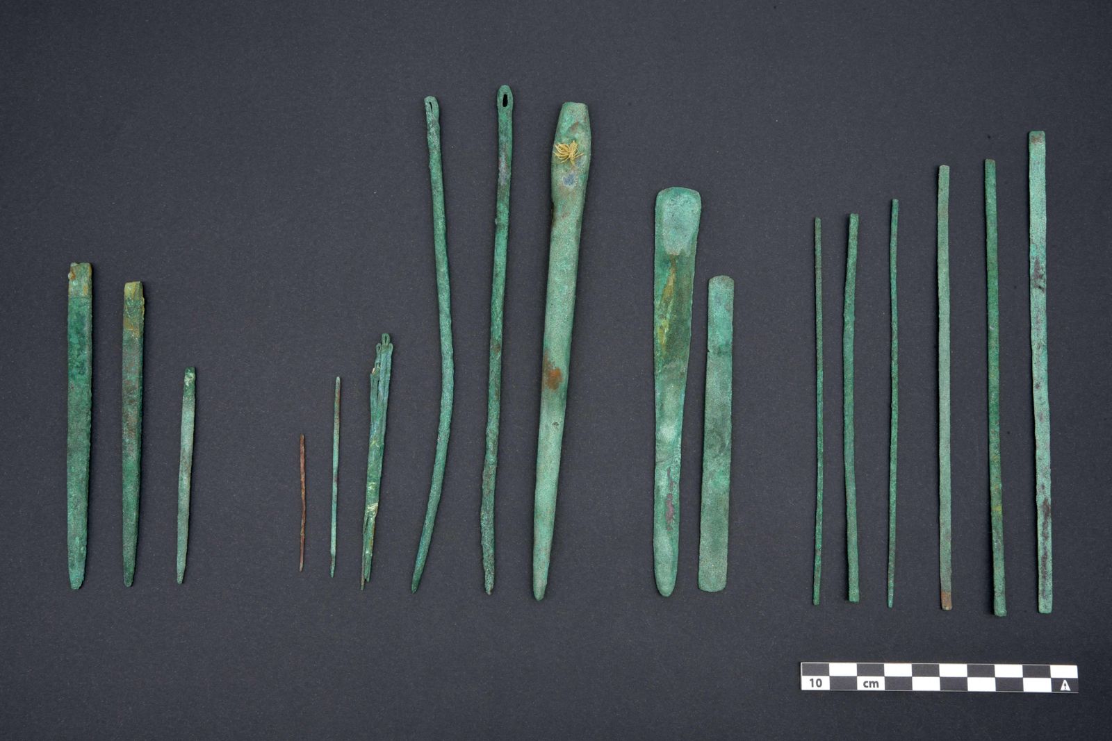 Handout picture distributed by the National Museum of Sican, Peru, on March 23, 2022, of surgical tools and other elements uncovered by archeologists in what is believed to be the tomb of a surgeon, who was buried wearing a 