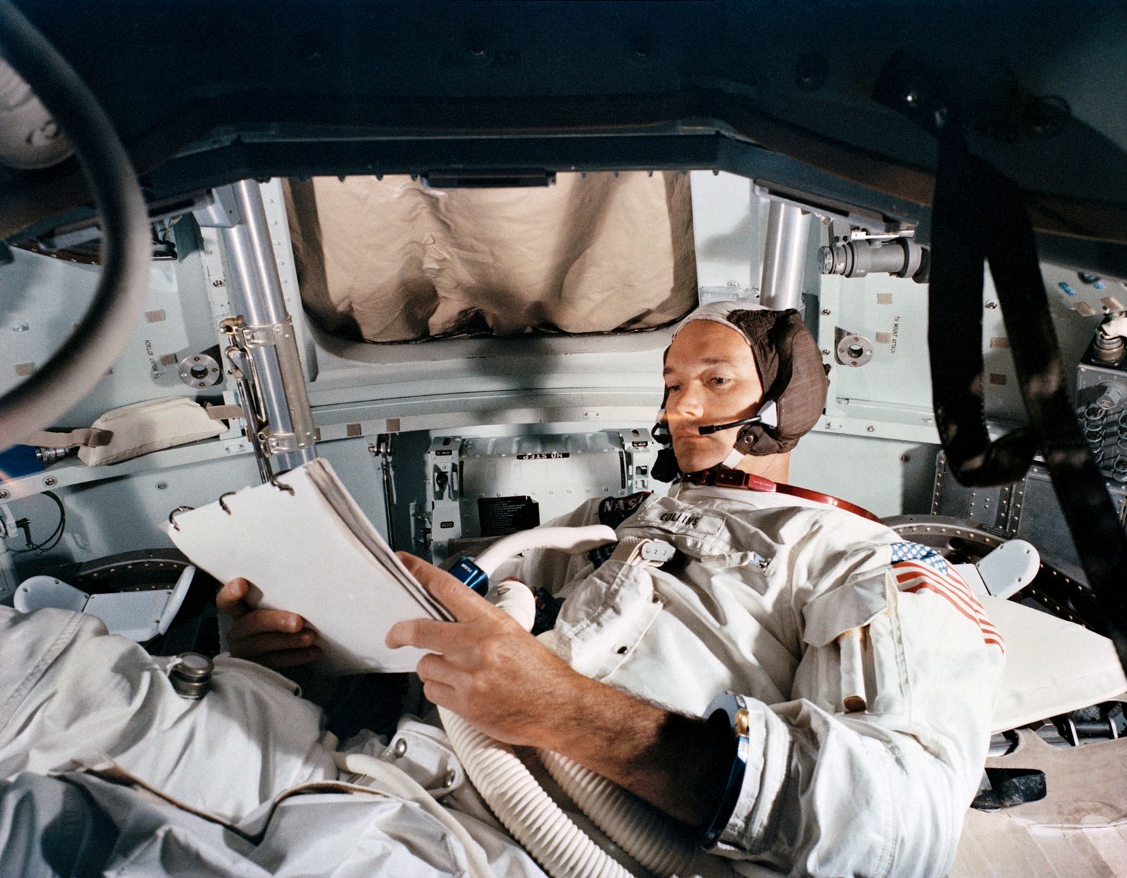 FILE PHOTO: Command Module pilot Michael Collins practices in the CM simulator at Kennedy Space Cente - REUTERS