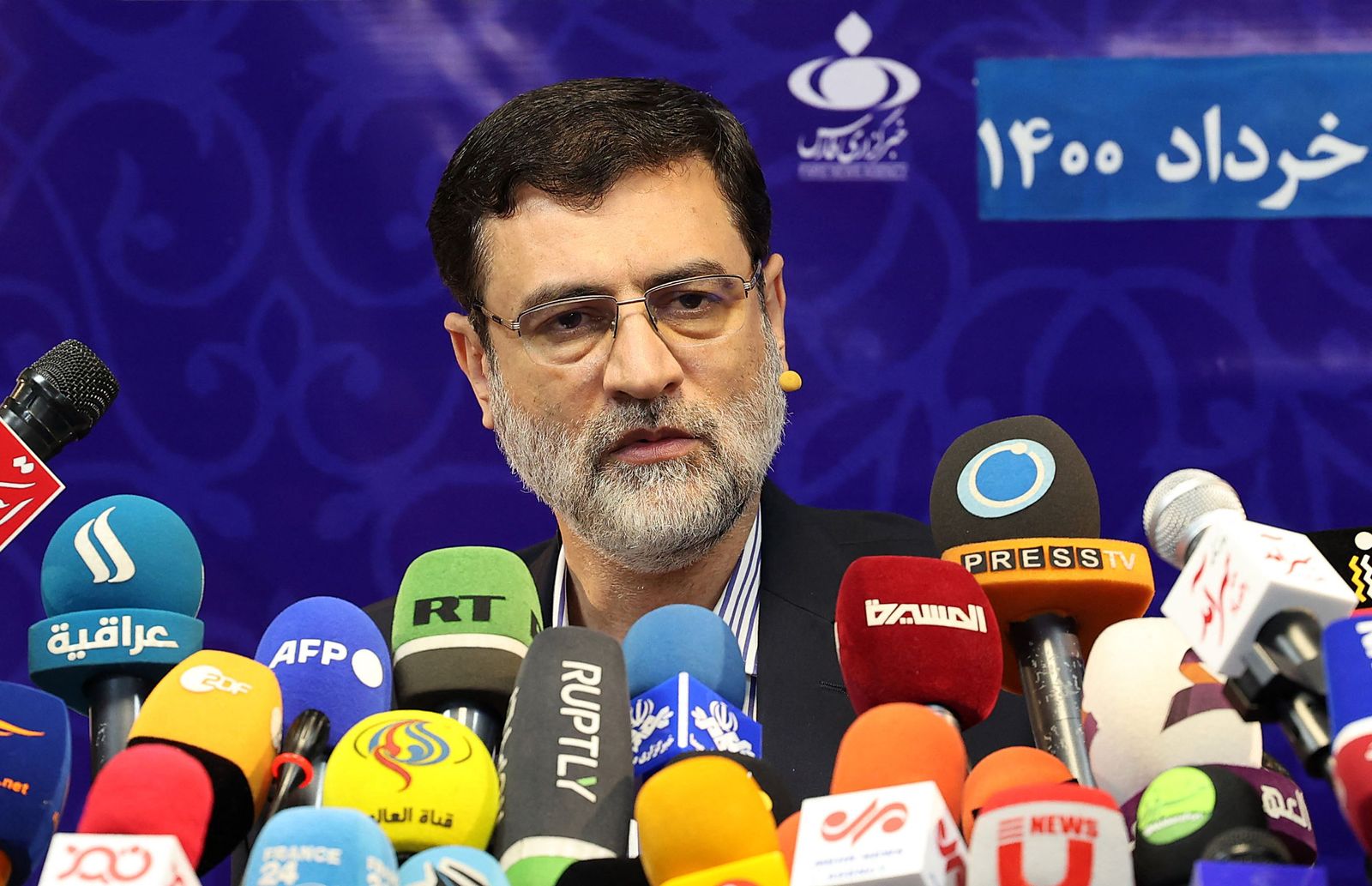 Iranian presidential candidate Amirhossein Ghazizadeh-Hashemi gives a press conference at the Fars News Agency in Tehran, on May 26, 2021. - Iran approved seven hopefuls to run in next month's presidential poll, with judiciary chief Ebrahim Raisi among the mainly ultraconservative candidates, while heavyweights Mahmoud Ahmadinejad and Ali Larijani were barred. (Photo by ATTA KENARE / AFP) - AFP