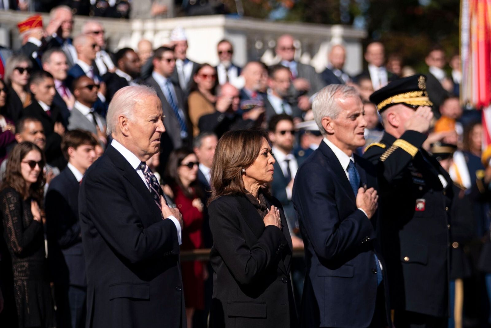 US President Joe Biden, from left, Vice President Kamala Harris, and Denis McDonough, US secretary of Veterans Affairs (VA), place their hands over their hearts during a wreath-laying ceremony at the Tomb of the Unknown Soldier at Arlington National Cemetery in Arlington, Virginia, US, on Monday, Nov. 11, 2024. Biden will argue in favor of continued US aid to Ukraine during the transition to President-elect Donald Trump�s administration, according to national security advisor Jake Sullivan. Photographer: Bonnie Cash/UPI/Bloomberg