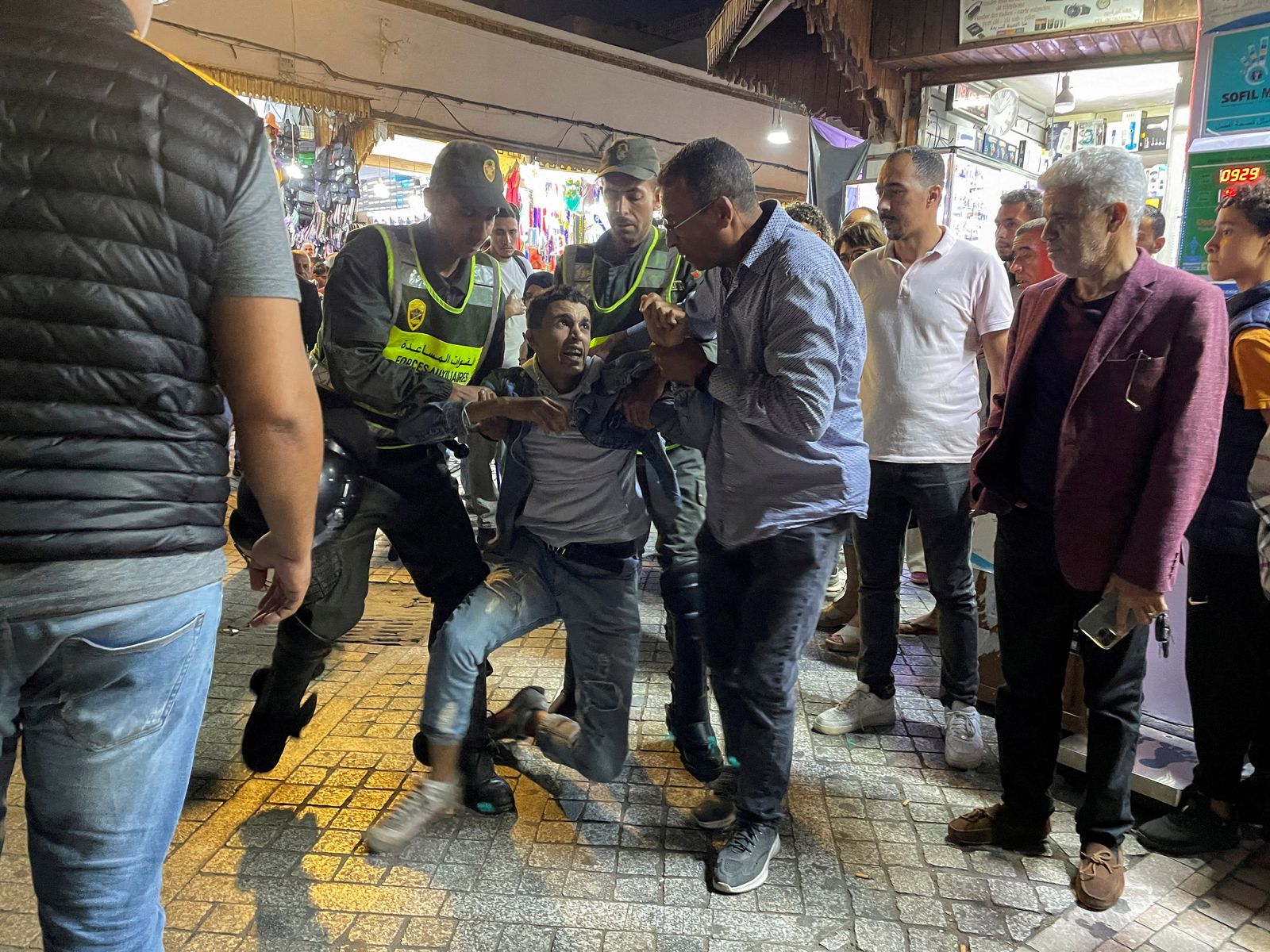 FILE PHOTO: Members of the security forces detain a man as they prevent a protest demanding reforms in education and health from taking place, in Rabat, Morocco, September 29, 2025. REUTERS/Ahmed El Jechtimi/File Photo