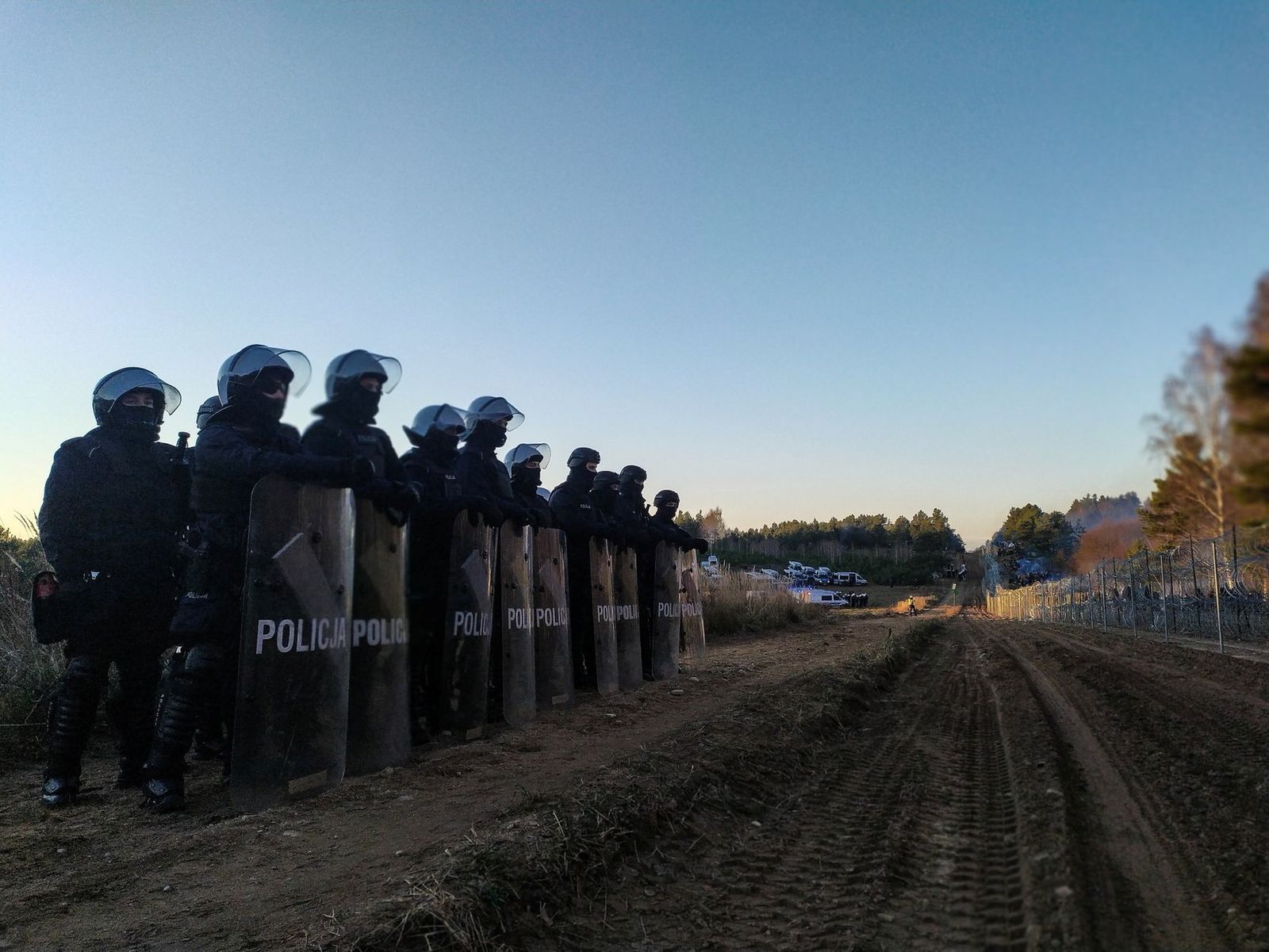 Polish police guard border fence on the Poland/Belarus border near Kuznica - via REUTERS