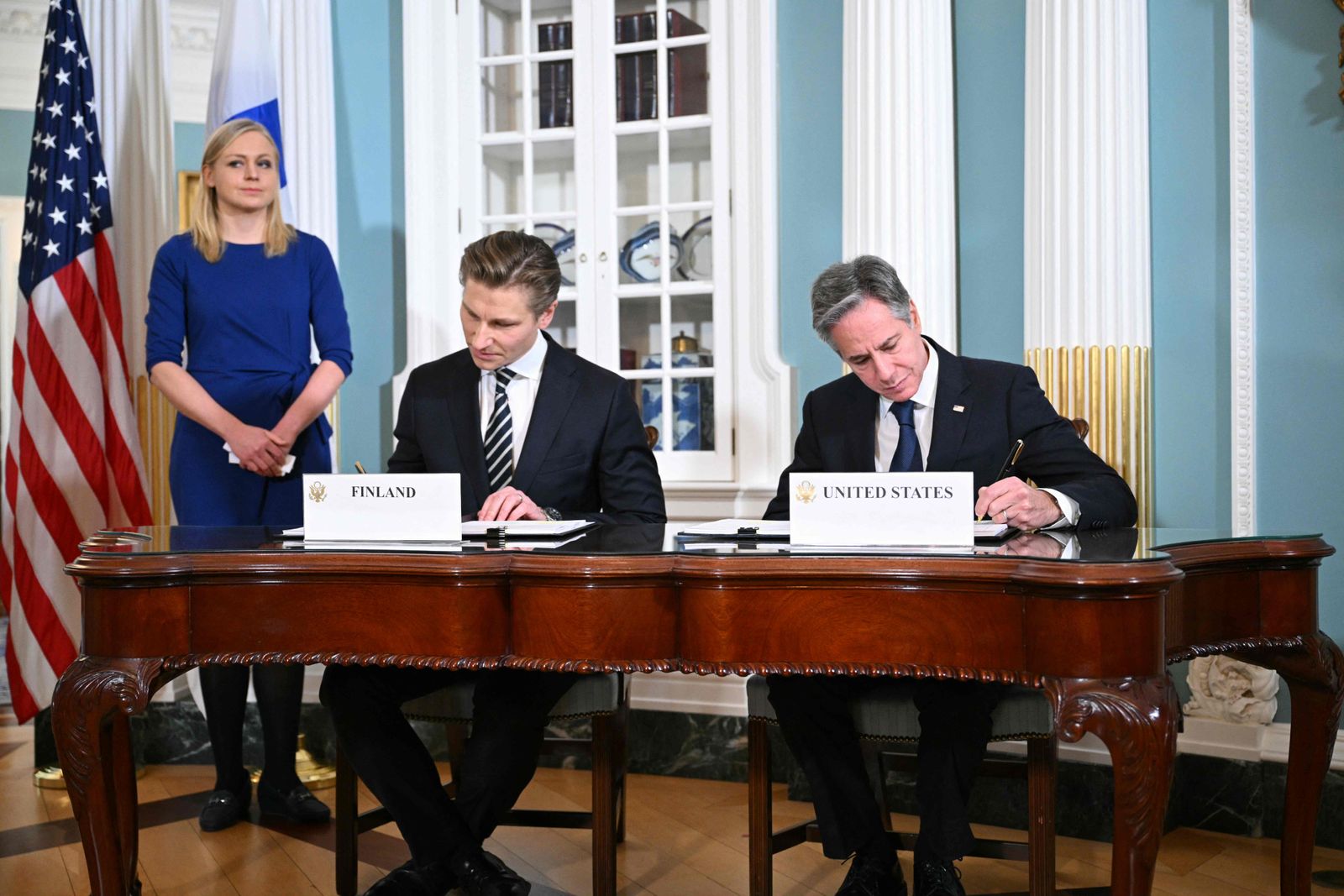 US Secretary of State Antony Blinken, with Finland�s Foreign Minister Elina Valtonen and Defense Minister Antti H�kk�nen sign a defense cooperation agreement in the Treaty Room of the State Department in Washington, DC on December 18, 2023. (Photo by Mandel NGAN / AFP)