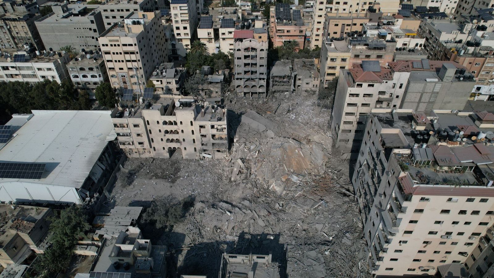 Dstroyed buildings and residential towers following an Israeli missile attack in the Rimal district of Gaza City, Gaza, on Sunday, Oct. 8. 2023. Fighting continued in southern Israel for a second day as Israeli Defence Forces sought to regain control of areas infiltrated yesterday by militants from the Gaza Strip. Photographer: Ahmad Salem/Bloomberg