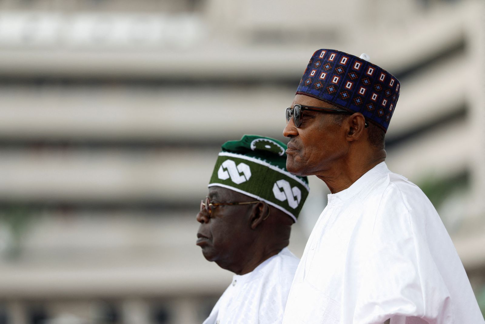 Nigeria's President Bola Tinubu stands next to his predecessor Muhammadu Buhari during his swearing-in ceremony in Abuja - REUTERS