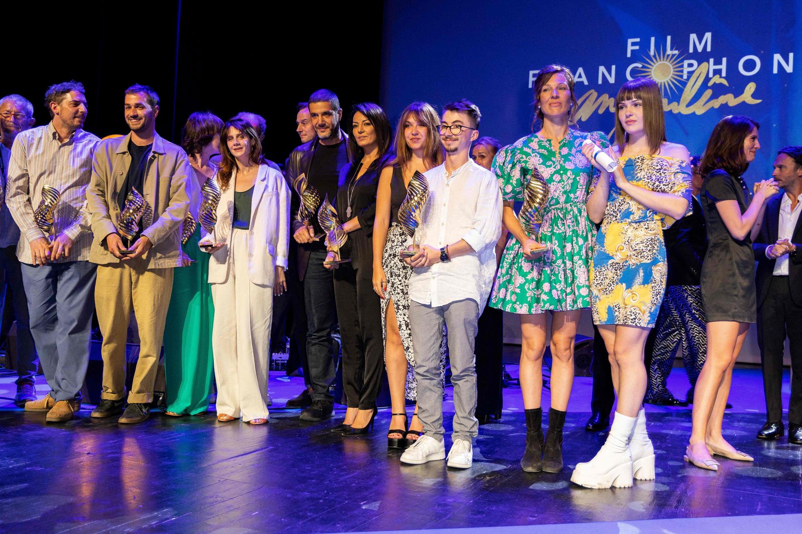 The prize-winners pose during the closing ceremony of the 15th Francophone Angouleme film festival in Angouleme, western France, on August 28, 2022. (Photo by YOHAN BONNET / AFP) - AFP