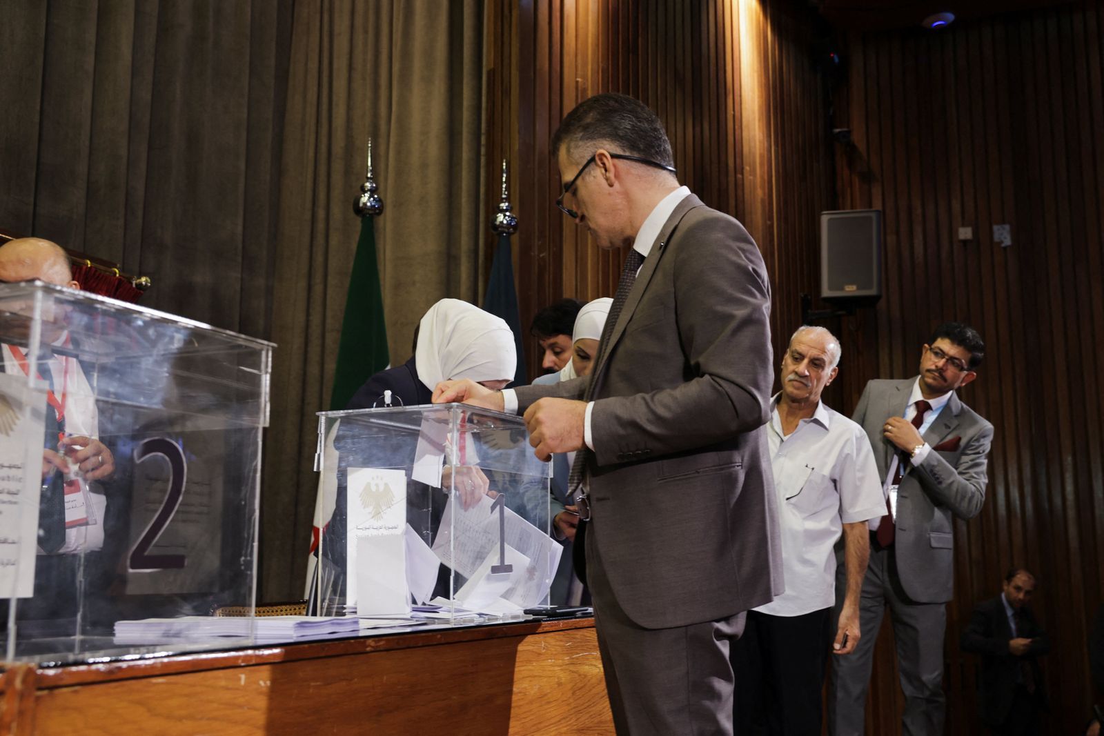 A member of the electoral colleges votes to select his candidate for the new Syrian Parliament since Bashar al-Assad's government was toppled, in Damascus, Syria, October 5, 2025. REUTERS/Khalil Ashawi