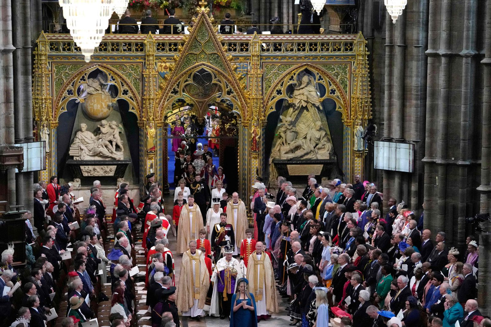 Britain's King Charles III wearing the Imperial state Crown, and Queen Camilla, wearing a modified version of Queen Mary's Crown leave Westminster Abbey after the Coronation Ceremonies in central London on May 6, 2023. - The set-piece coronation is the first in Britain in 70 years, and only the second in history to be televised. Charles will be the 40th reigning monarch to be crowned at the central London church since King William I in 1066. Outside the UK, he is also king of 14 other Commonwealth countries, including Australia, Canada and New Zealand. (Photo by Kirsty Wigglesworth / POOL / AFP) - AFP