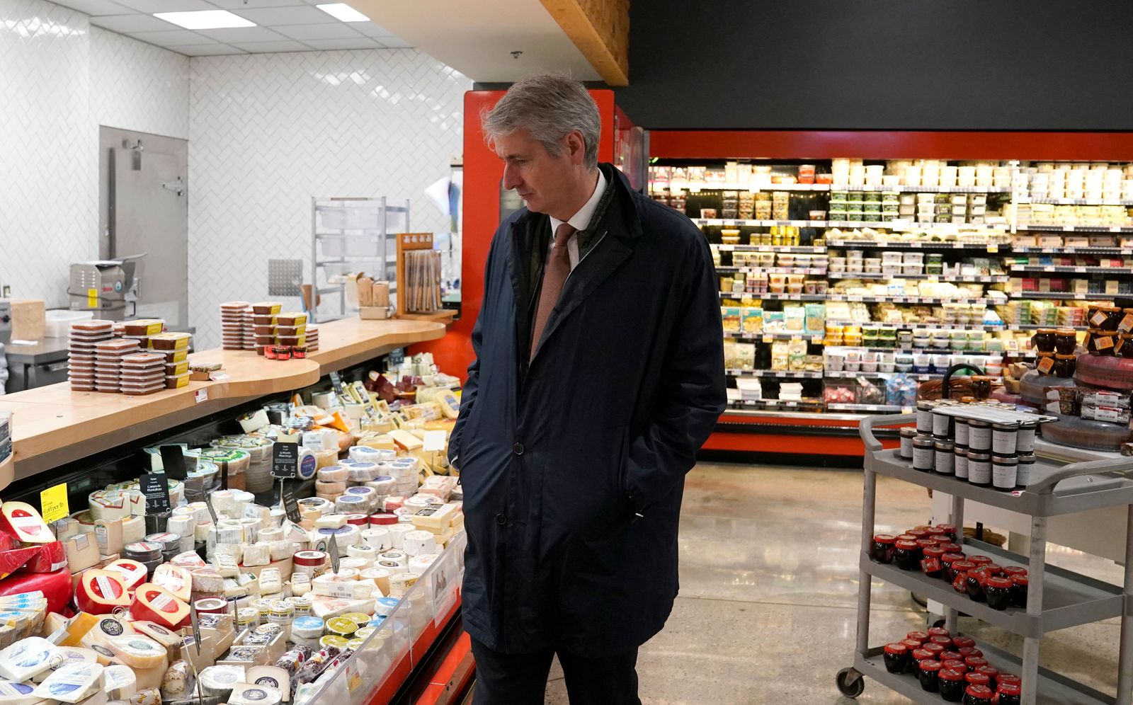 Emmanuel Besnier, chief executive officer of French family-owned dairy products group Lactalis looks at products at a Whole Foods after touring the Stonyfield Farm plant in Londonderry, New Hampshire on May 4, 2022. - The new production line at Stonyfield's Londonderry plant churns out 800,000 plastic yogurts a week, and the company, a subsidiary of French dairy giant Lactalis, plans to build a second line this year. Stonyfield's organic baby and children's products, based in Londonderry in the northeastern U.S., are the fastest-growing category in the U.S. for Lactalis, and the company wants to take advantage of that. (Photo by TIMOTHY A. CLARY / AFP) - AFP