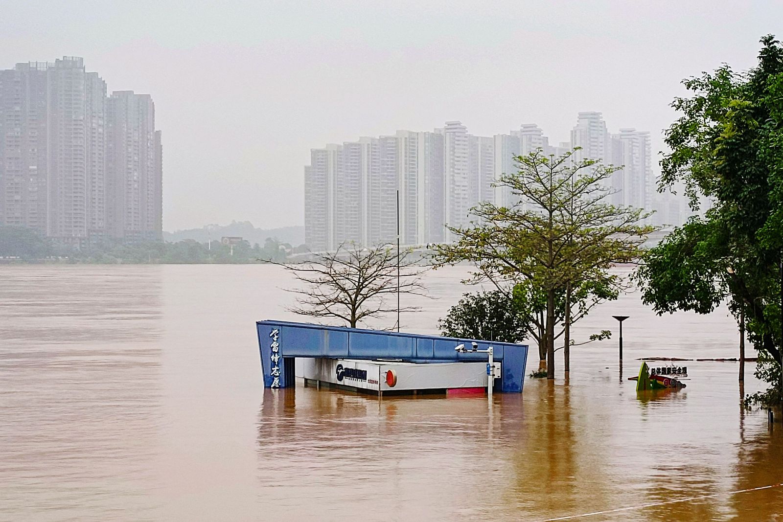 This photo taken on April 22, 2024 shows a submerged building at a flooded park after heavy rains in Qingyaun, in southern China's Guangdong province. (Photo by AFP) / China OUT