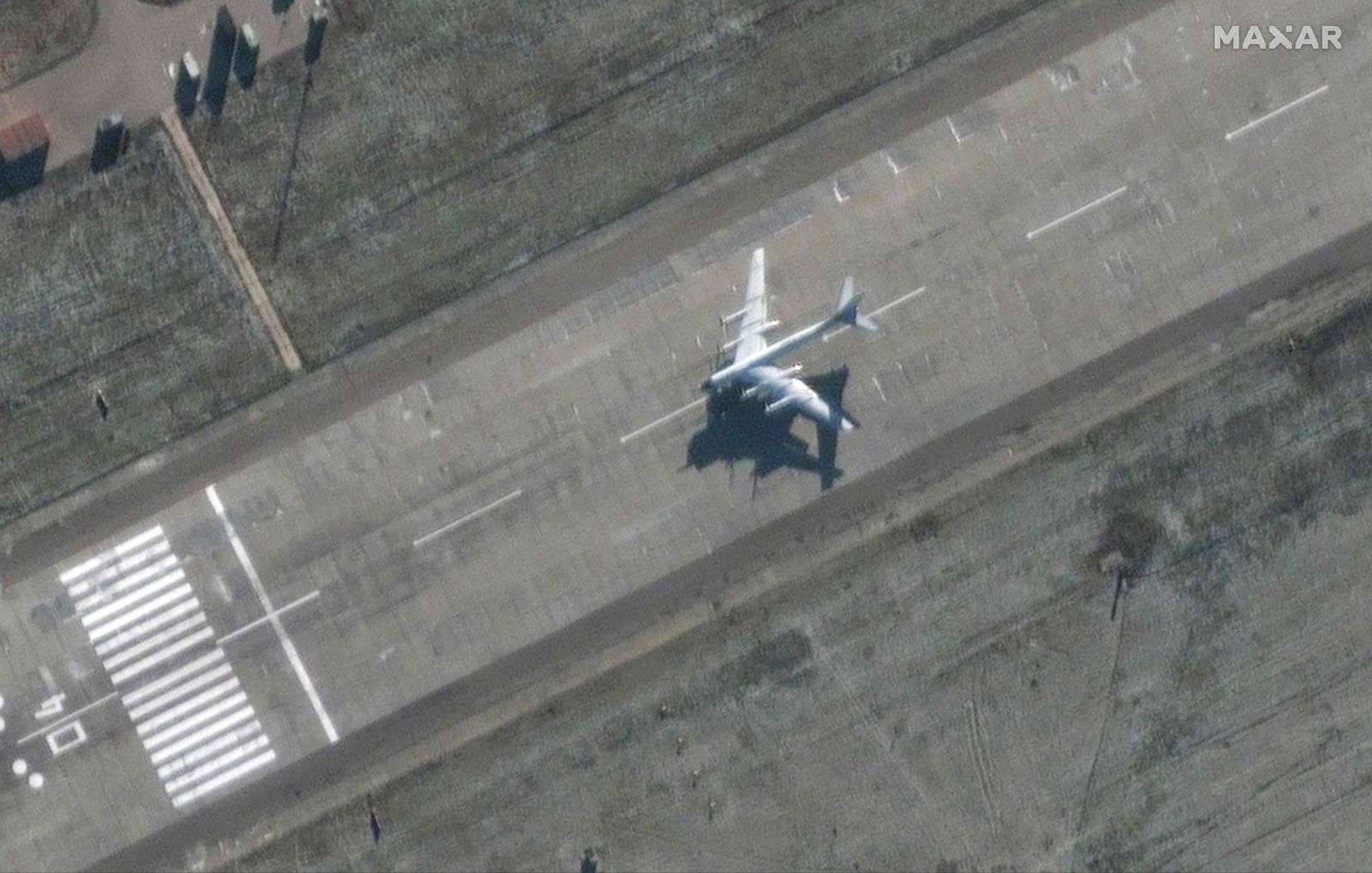 This handout satellite image released and collected by Maxar Technologies on December 5, 2022 shows flight activity of a Tu-95 bomber at Engels Airbase, in Russia which is home to a strategic bomber military base. - News reports said two Russian airfields including a base for the country's strategic aircraft that Kyiv says have been used to strike Ukraine, had been rocked by explosions. (Photo by Handout / Satellite image �2022 Maxar Technologies / AFP) / -----EDITORS NOTE --- RESTRICTED TO EDITORIAL USE - MANDATORY CREDIT 