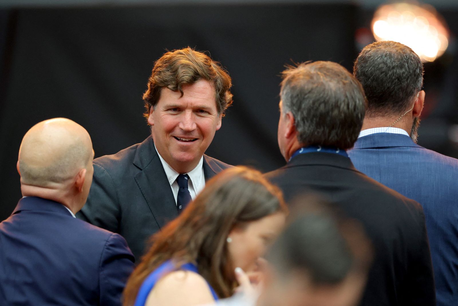 Political commentator Tucker Carlson arrives for a memorial service for slain conservative commentator Charlie Kirk at State Farm Stadium, on the day of a memorial service for slain conservative commentator Charlie Kirk, in Glendale, Arizona, U.S., September 21, 2025.  REUTERS/Carlos Barria