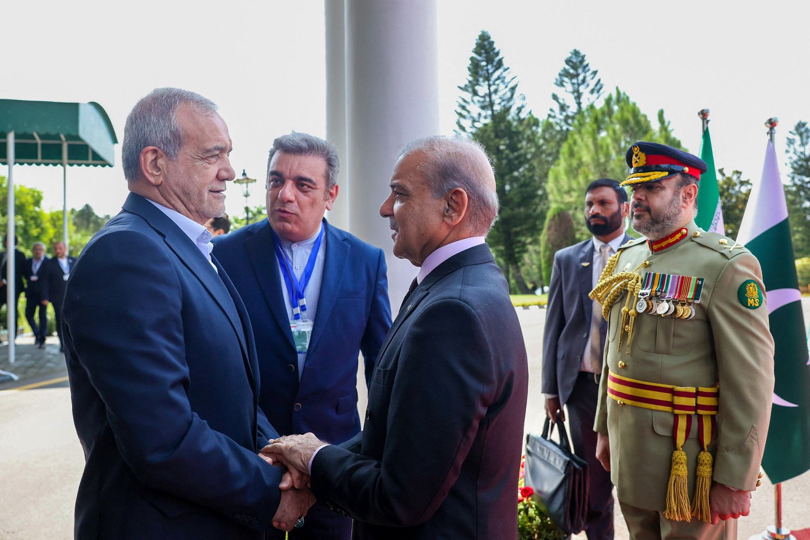 Iranian President Masoud Pezeshkian is welcomed by Pakistani Prime Minister Shehbaz Sharif in Islamabad, Pakistan, August 3, 2025. Iran's Presidential website/WANA (West Asia News Agency)/Handout via REUTERS ATTENTION EDITORS - THIS PICTURE WAS PROVIDED BY A THIRD PARTY