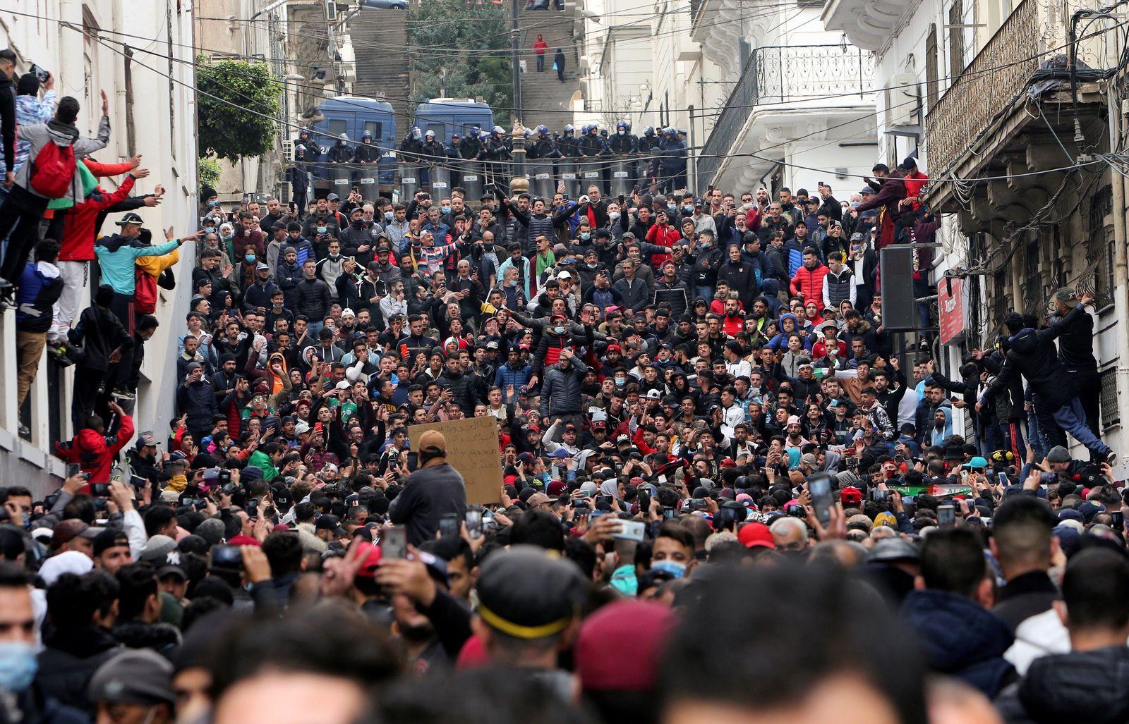 Demonstrators take part in a protest in Algiers - REUTERS