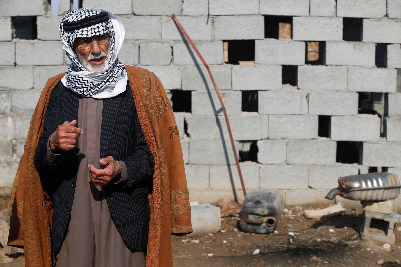 Jabbar Alwan, who lost four family members to violence, is pictured at the scene of an attack by Islamic States (IS) group members, in the village of Albu Bali in the Dyala province northeast of the Iraqi capital Baghdad, on January 12, 2023. - Iraq has come a long way since major fighting ended over five years ago against the Islamic State (IS) group, putting an end to the their self-declared 
