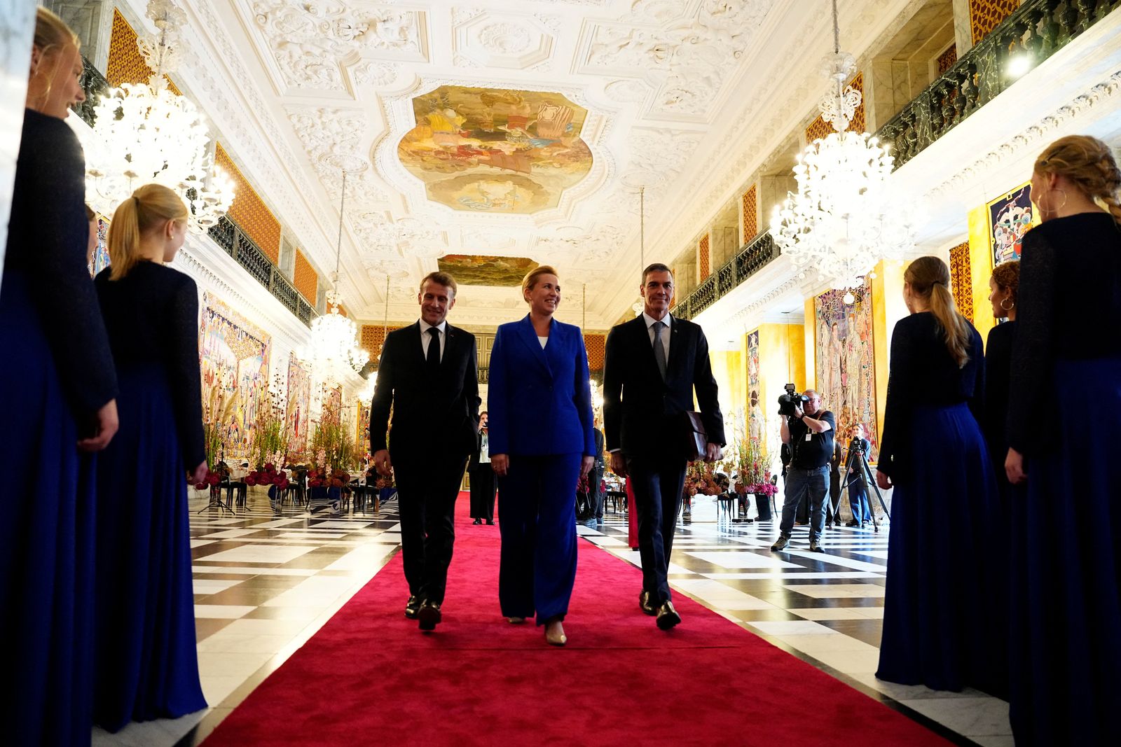 France's President Emmanuel Macron, Denmarks Prime Minister Mette Frederiksen and Spain's Prime Minister Pedro Sanchez arrive for an informal summit in the Danish parliament at Christiansborg Castle in Copenhagen, Denmark, October 1, 2025. Ritzau Scanpix/Mads Claus Rasmussen via REUTERS    ATTENTION EDITORS - THIS IMAGE WAS PROVIDED BY A THIRD PARTY. DENMARK OUT. NO COMMERCIAL OR EDITORIAL SALES IN DENMARK.