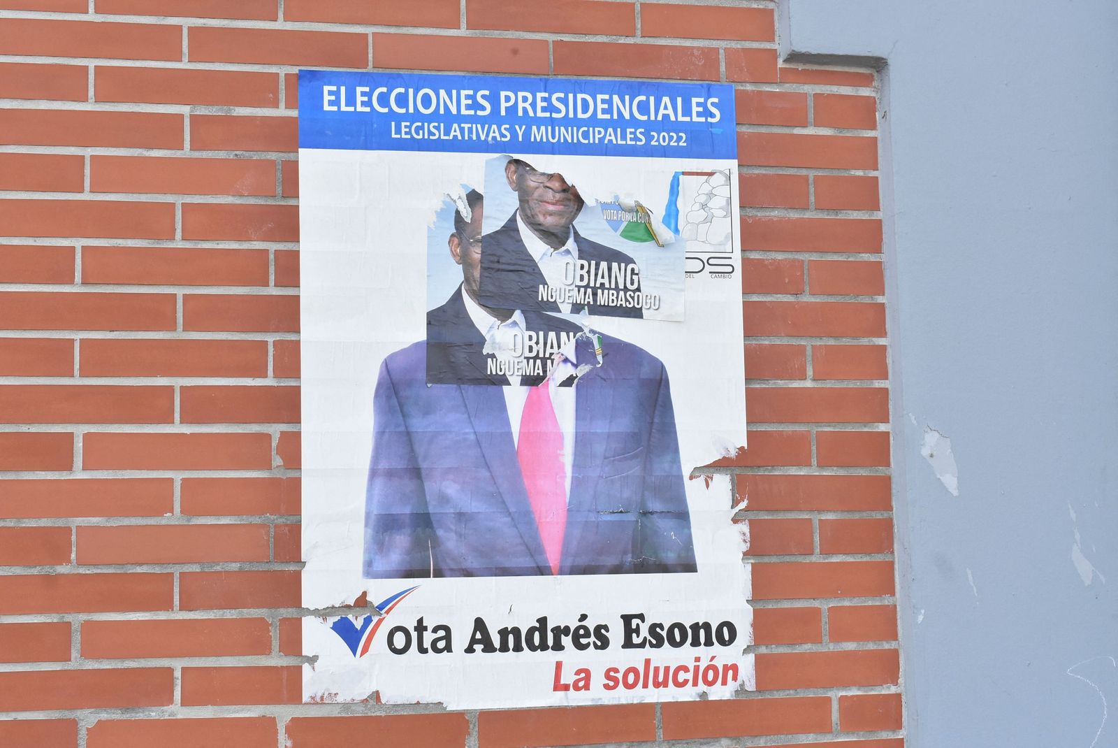 A campaign poster for for Equatorial Guinea President, Teodoro Obiang Nguema Mbasogo, is pated over a campaign poster of opponent Andres Esono Ondo of the Convergence for Social Democracy (CPDS),  in Malabo on November 17, 2022. - Equatorial Guinea's iron-fisted president, Teodoro Obiang Nguema Mbasogo, is eyeing a sixth term in office in elections on November 20, 2022, extending a world-record 43 years in power.
Obiang, 80, seized power in August 1979, toppling his uncle, Francisco Macias Ngueme, who was then executed by firing squad. (Photo by Samuel OBIANG / AFP) - AFP